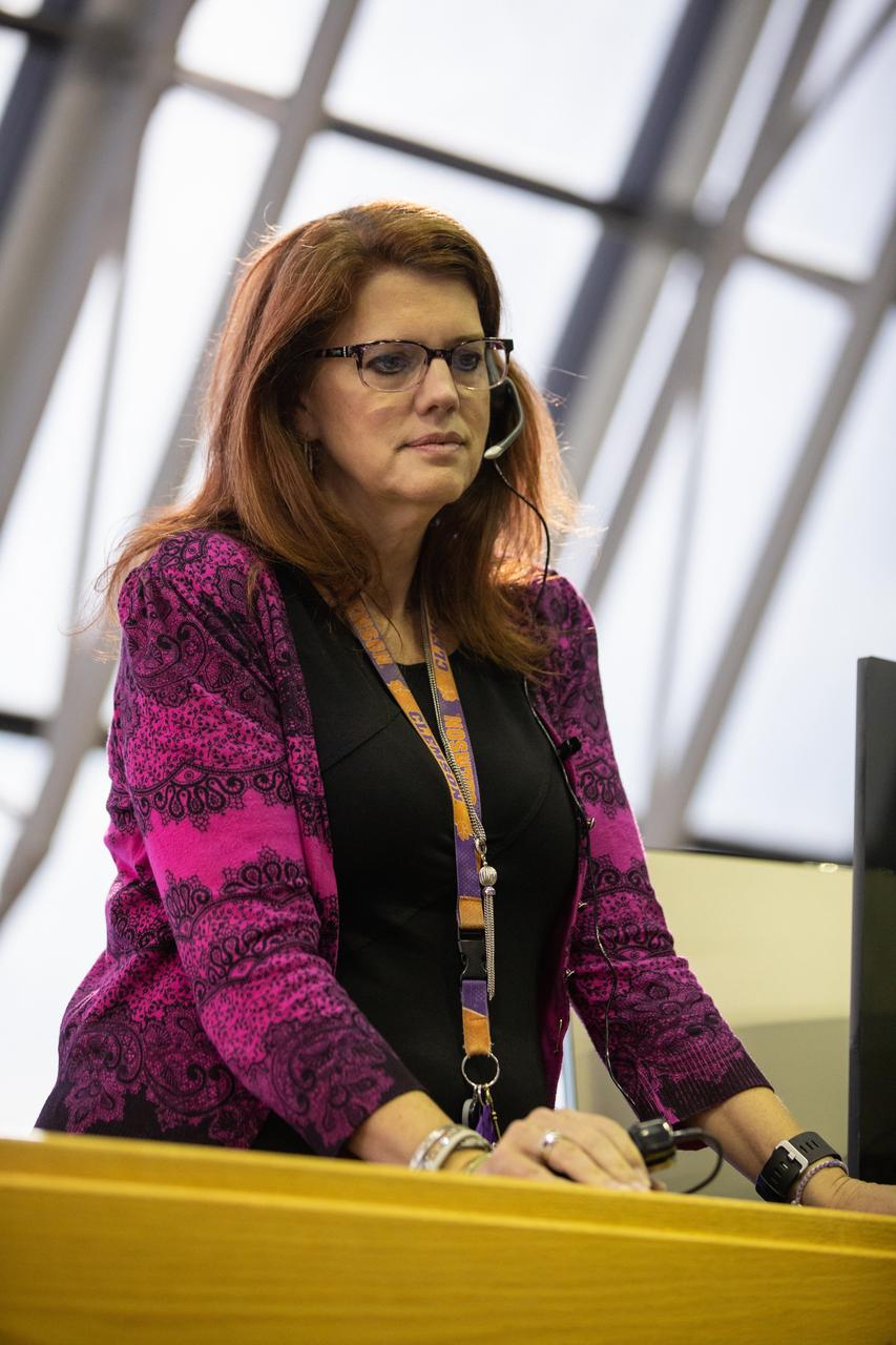 Artemis 1 Launch Director Charlie Blackwell-Thompson leads the launch team through validation testing inside Firing Room 1 in the Launch Control Center at NASA’s Kennedy Space Center in Florida on July 11, 2019.  The team includes personnel with NASA’s Exploration Ground Systems (EGS) and Jacobs Test and Operations Contract (TOSC). The simulation was designed to validate the firing room consoles and communications systems, as well as the new Spaceport Command and Control System (SCCS), which will operate, monitor and coordinate ground equipment in preparation for Artemis 1, the uncrewed first flight of the Space Launch System rocket and Orion spacecraft. 