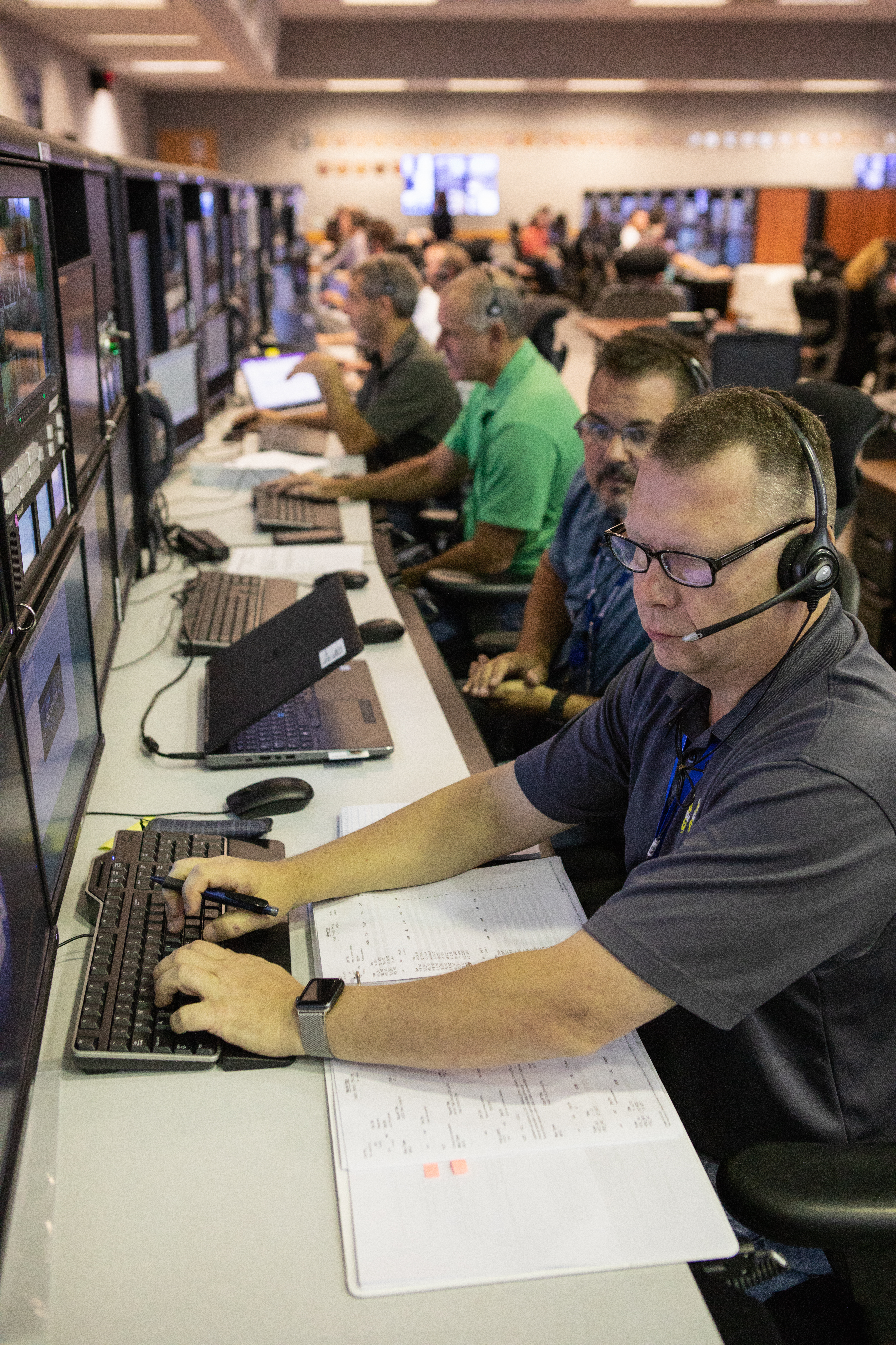 Members of the Artemis 1 launch team, including personnel with NASA’s Exploration Ground Systems (EGS) and Jacobs Test and Operations Contract (TOSC), participate in validation testing inside Firing Room 1 in the Launch Control Center at NASA’s Kennedy Space Center in Florida on July 11, 2019. The team includes personnel with NASA’s Exploration Ground Systems (EGS) and Jacobs Test and Operations Contract (TOSC). The simulation was designed to validate the firing room consoles and communications systems, as well as the new Spaceport Command and Control System (SCCS), which will operate, monitor and coordinate ground equipment in preparation for Artemis 1, the uncrewed first flight of the Space Launch System rocket and Orion spacecraft. 