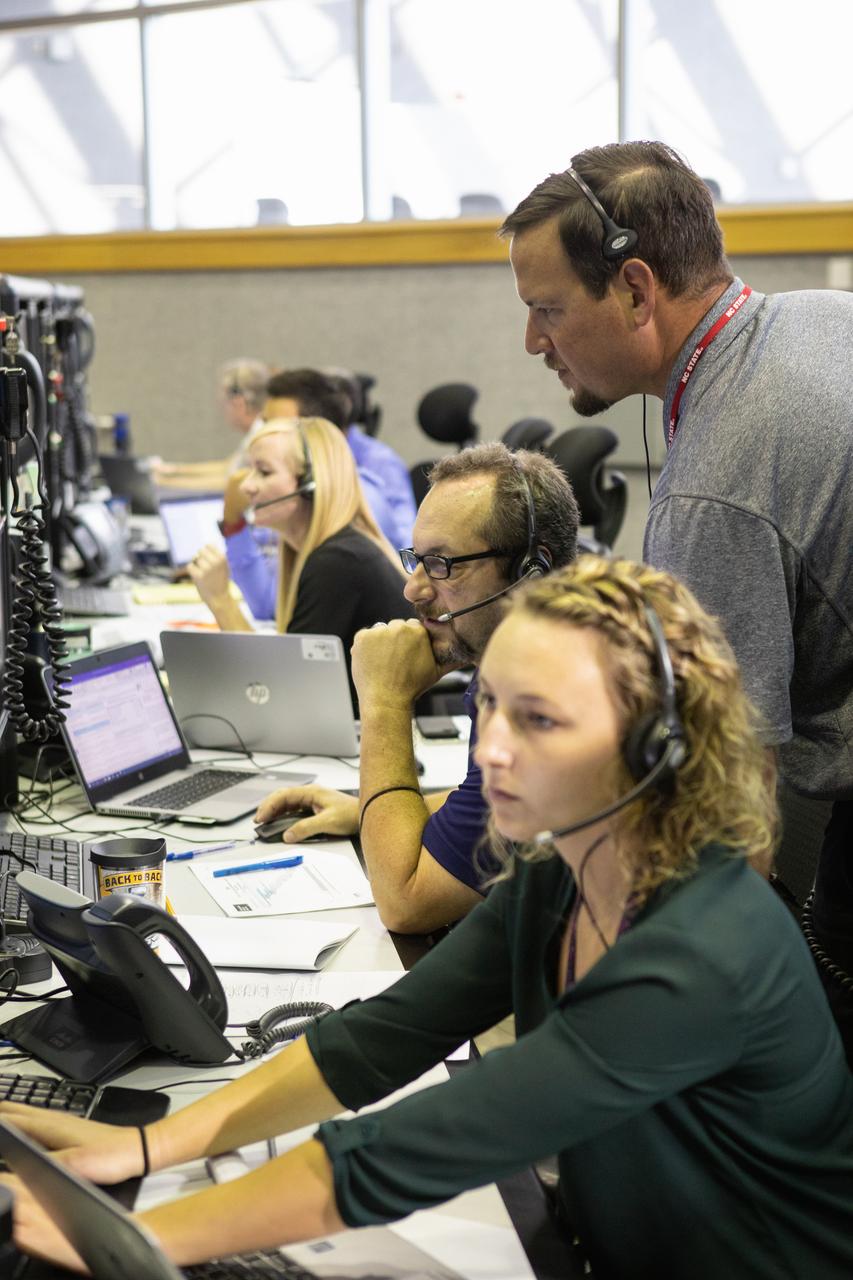 Members of the Artemis 1 launch team, including personnel with NASA’s Exploration Ground Systems (EGS) and Jacobs Test and Operations Contract (TOSC), participate in validation testing inside Firing Room 1 in the Launch Control Center at NASA’s Kennedy Space Center in Florida on July 11, 2019. The simulation was designed to validate the firing room consoles and communications systems, as well as the new Spaceport Command and Control System (SCCS), which will operate, monitor and coordinate ground equipment in preparation for Artemis 1, the uncrewed first flight of the Space Launch System rocket and Orion spacecraft. 