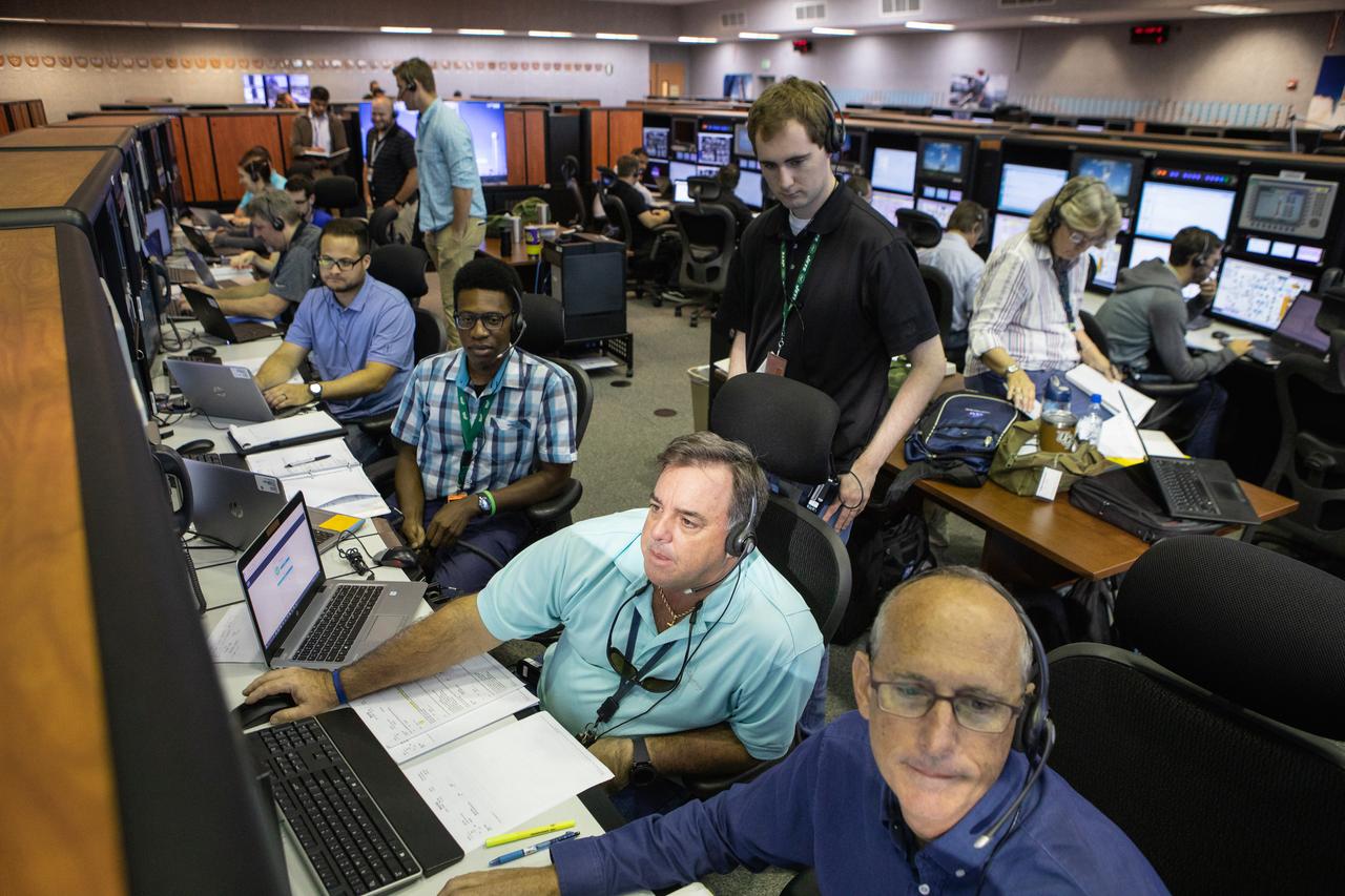 Members of the Artemis 1 launch team, including personnel with NASA’s Exploration Ground Systems (EGS) and Jacobs Test and Operations Contract (TOSC), participate in validation testing inside Firing Room 1 in the Launch Control Center at NASA’s Kennedy Space Center in Florida on July 11, 2019. The simulation was designed to validate the firing room consoles and communications systems, as well as the new Spaceport Command and Control System (SCCS), which will operate, monitor and coordinate ground equipment in preparation for Artemis 1, the uncrewed first flight of the Space Launch System rocket and Orion spacecraft. 