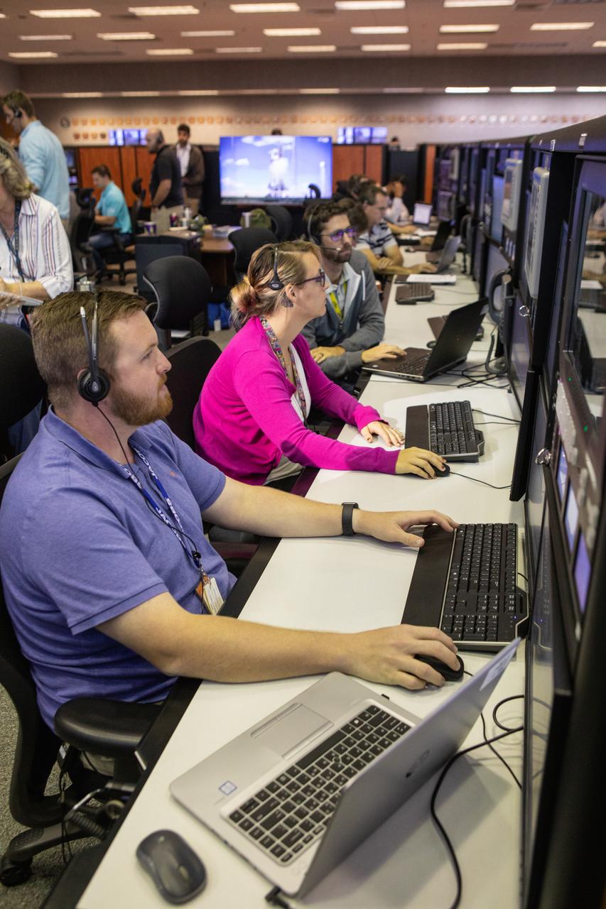 Members of the Artemis 1 launch team, including personnel with NASA’s Exploration Ground Systems (EGS) and Jacobs Test and Operations Contract (TOSC), participate in validation testing inside Firing Room 1 in the Launch Control Center at NASA’s Kennedy Space Center in Florida on July 11, 2019. The simulation was designed to validate the firing room consoles and communications systems, as well as the new Spaceport Command and Control System (SCCS), which will operate, monitor and coordinate ground equipment in preparation for Artemis 1, the uncrewed first flight of the Space Launch System rocket and Orion spacecraft. 