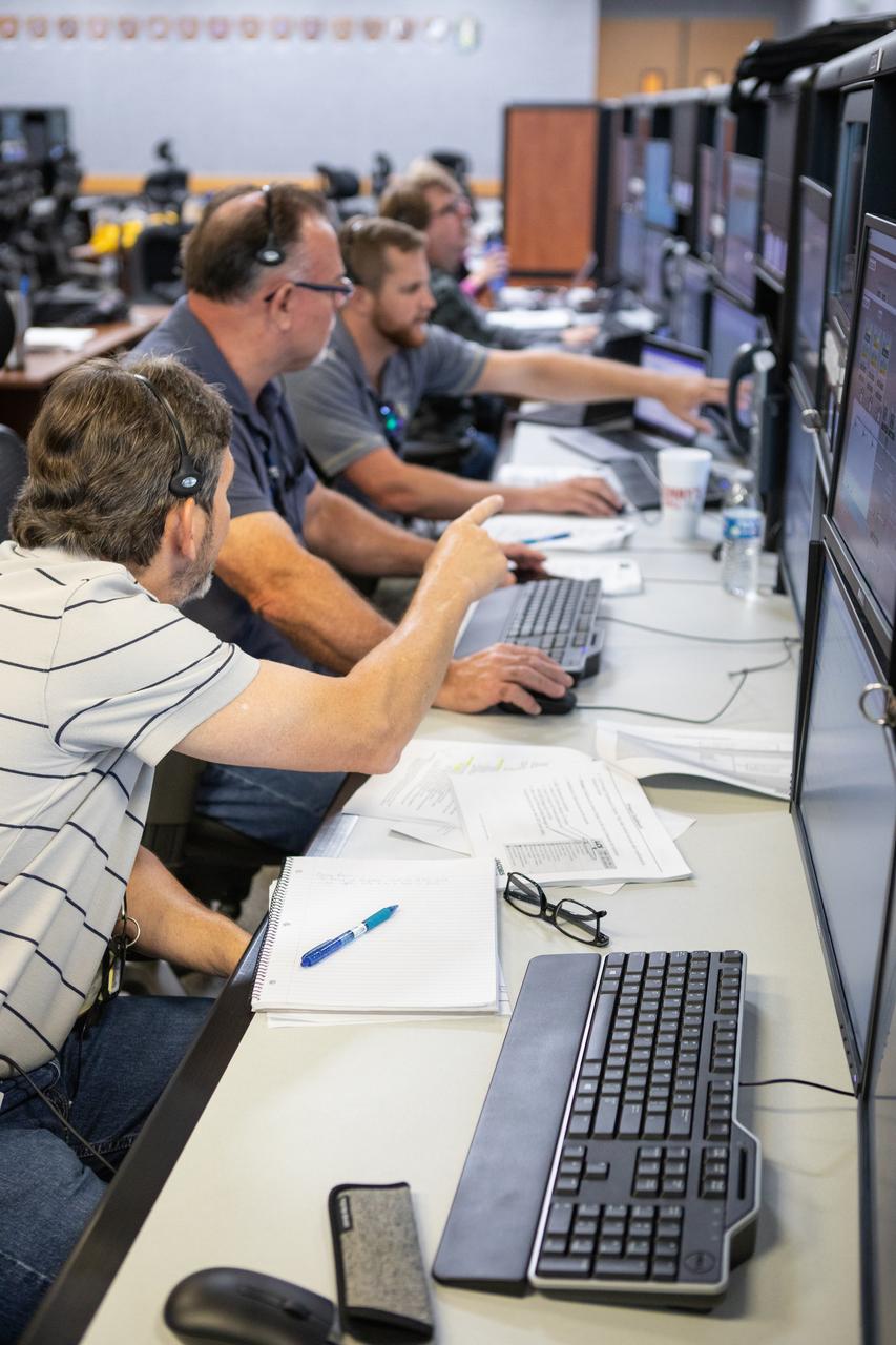 Members of the Artemis 1 launch team, including personnel with NASA’s Exploration Ground Systems (EGS) and Jacobs Test and Operations Contract (TOSC), participate in validation testing inside Firing Room 1 in the Launch Control Center at NASA’s Kennedy Space Center in Florida on July 11, 2019. The simulation was designed to validate the firing room consoles and communications systems, as well as the new Spaceport Command and Control System (SCCS), which will operate, monitor and coordinate ground equipment in preparation for Artemis 1, the uncrewed first flight of the Space Launch System rocket and Orion spacecraft. 
