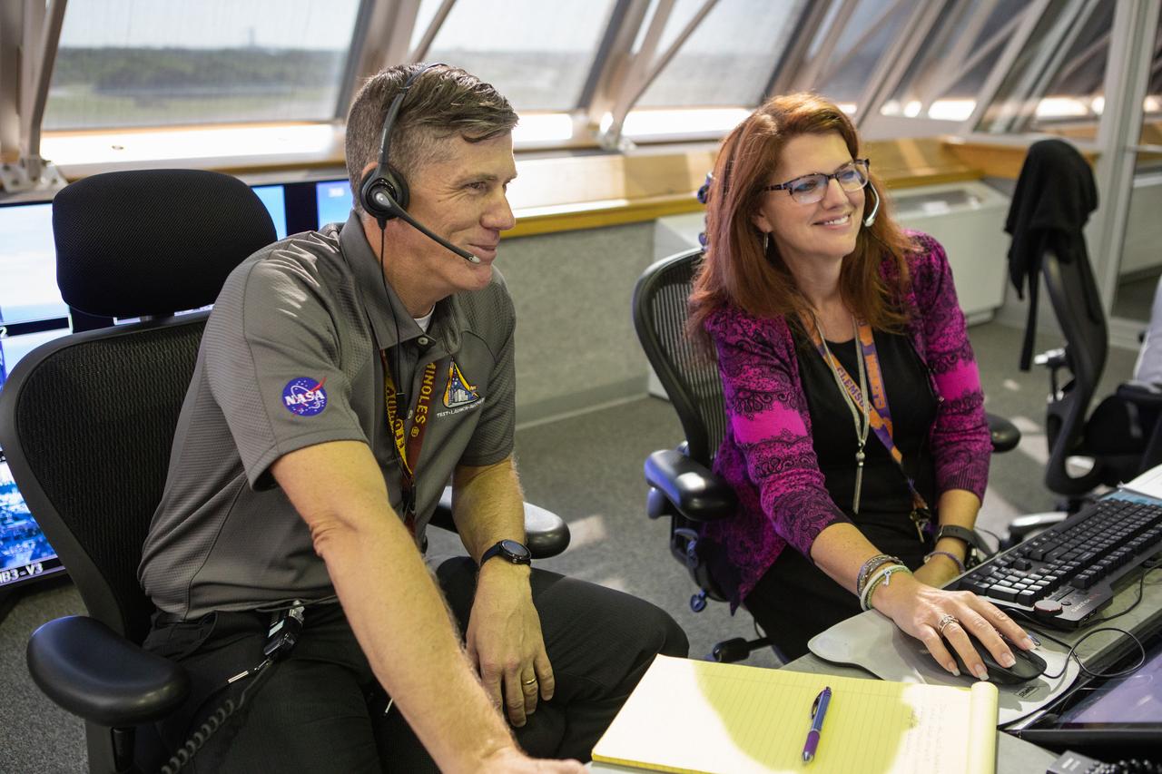 From left, Jeremy Graeber, chief NASA test director, and Charlie Blackwell-Thompson, Artemis 1 launch director, participate in validation testing inside Firing Room 1 in the Launch Control Center at NASA’s Kennedy Space Center in Florida on July 11, 2019.  The launch team includes personnel with NASA’s Exploration Ground Systems (EGS) and Jacobs Test and Operations Contract (TOSC). The simulation was designed to validate the firing room consoles and communications systems, as well as the new Spaceport Command and Control System (SCCS), which will operate, monitor and coordinate ground equipment in preparation for Artemis 1, the uncrewed first flight of the Space Launch System rocket and Orion spacecraft. 