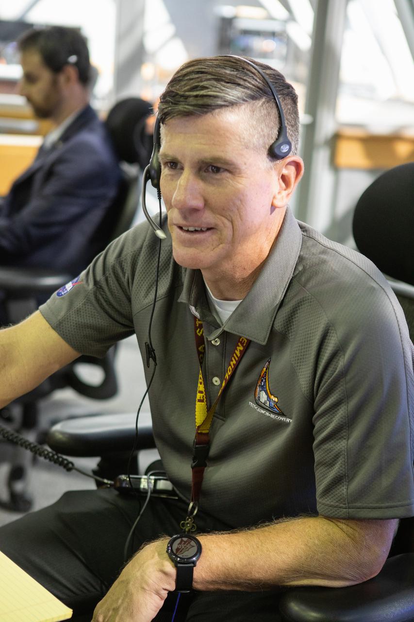 Jeremy Graeber, chief NASA test director, participates in validation testing inside Firing Room 1 in the Launch Control Center at NASA’s Kennedy Space Center in Florida on July 11, 2019.  The Artemis 1 launch team includes personnel with NASA’s Exploration Ground Systems (EGS) and Jacobs Test and Operations Contract (TOSC). The simulation was designed to validate the firing room consoles and communications systems, as well as the new Spaceport Command and Control System (SCCS), which will operate, monitor and coordinate ground equipment in preparation for Artemis 1, the uncrewed first flight of the Space Launch System rocket and Orion spacecraft. 