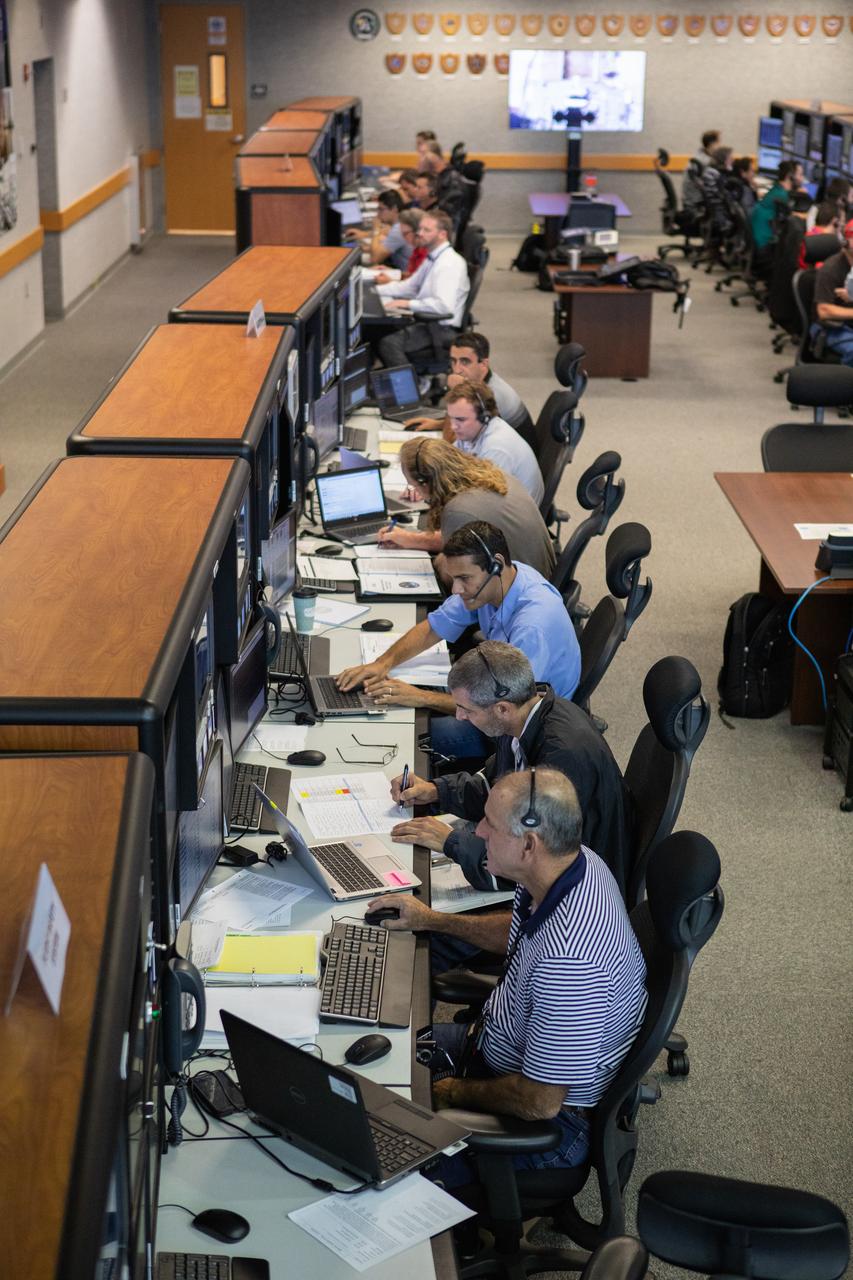 Members of the Artemis 1 launch team, including personnel with NASA’s Exploration Ground Systems (EGS) and Jacobs Test and Operations Contract (TOSC), monitor activities during the first formal terminal countdown simulation inside Firing Room 1 in the Launch Control Center at NASA’s Kennedy Space Center in Florida on July 12, 2019.  This was the first in a series of simulations to help the team prepare for the launch of Artemis 1, the uncrewed first flight of the Space Launch System rocket and Orion spacecraft. 