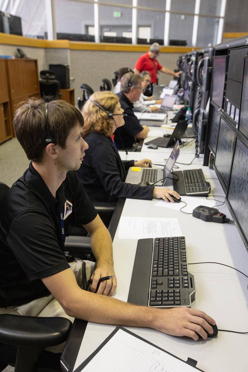 Members of the Artemis 1 launch team, including personnel with NASA’s Exploration Ground Systems (EGS) and Jacobs Test and Operations Contract (TOSC), monitor activities during the first formal terminal countdown simulation inside Firing Room 1 in the Launch Control Center at NASA’s Kennedy Space Center in Florida on July 12, 2019.  This was the first in a series of simulations to help the team prepare for the launch of Artemis 1, the uncrewed first flight of the Space Launch System rocket and Orion spacecraft. 