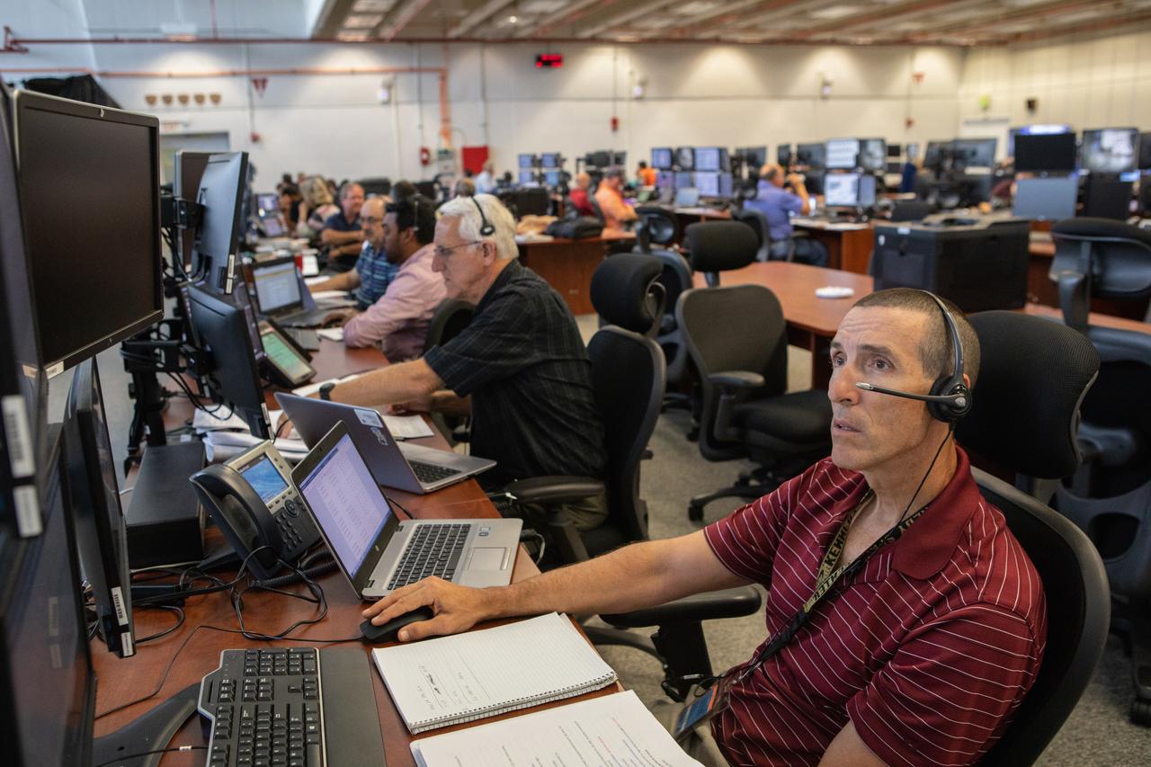 Members of the Artemis 1 launch team, including personnel with NASA’s Exploration Ground Systems (EGS) and Jacobs Test and Operations Contract (TOSC), monitor activities during the first formal terminal countdown simulation inside Firing Room 1 in the Launch Control Center at NASA’s Kennedy Space Center in Florida on July 12, 2019.  This was the first in a series of simulations to help the team prepare for the launch of Artemis 1, the uncrewed first flight of the Space Launch System rocket and Orion spacecraft. 