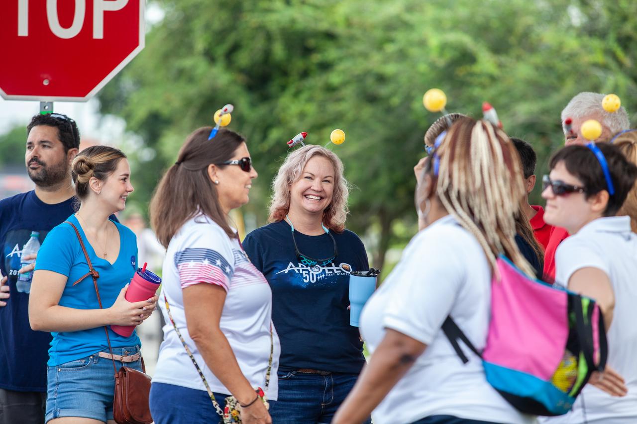 Employees from NASA’s Kennedy Space Center mingle before the start of the “Man on the Moon” astronaut parade in Cocoa Beach, Florida, on July 13, 2019. The parade was held to honor the 50th anniversary of NASA’s Saturn V/Apollo 11 launch and landing on the Moon. 