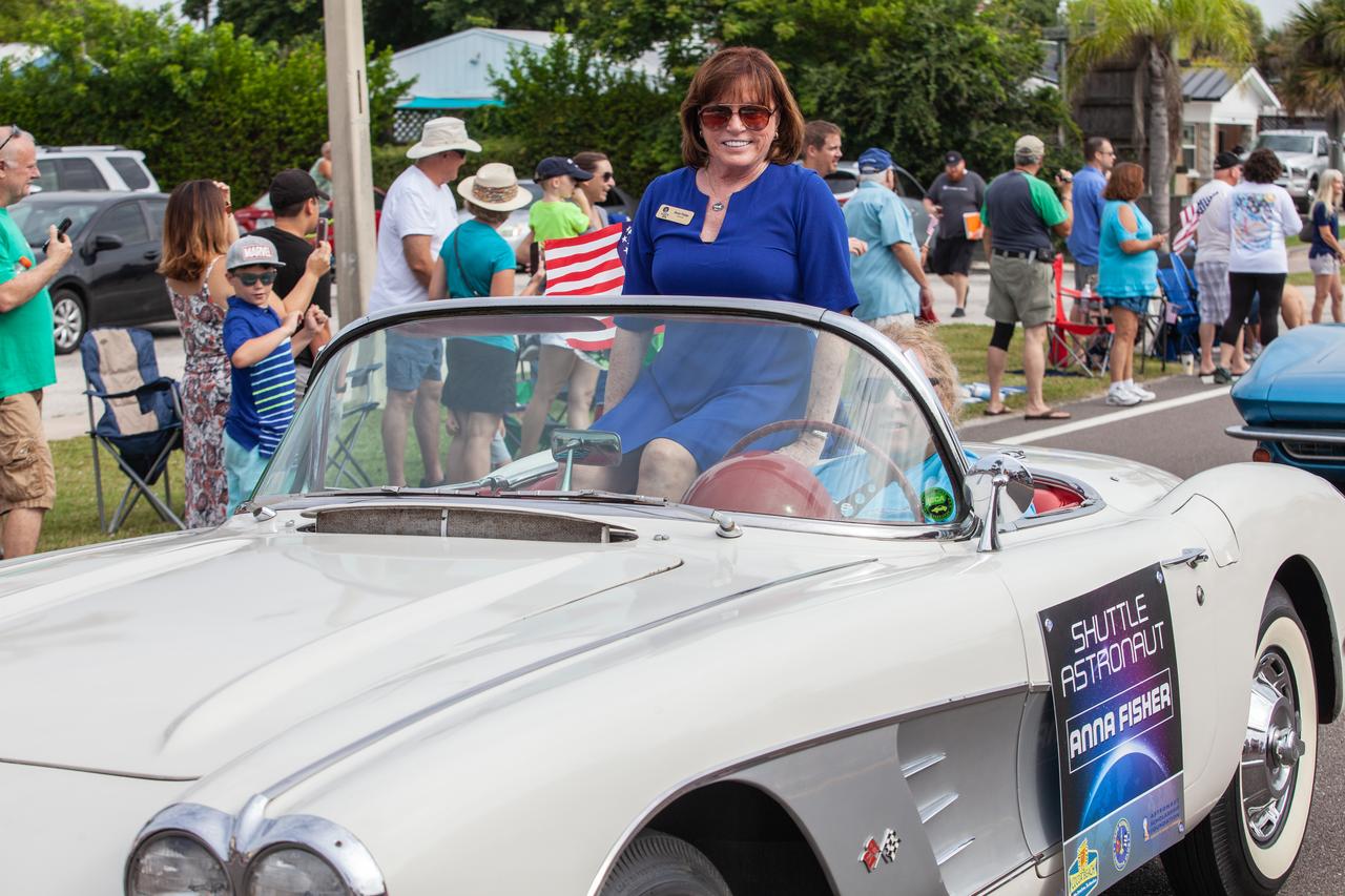 Retired space shuttle astronaut Anna Fisher rides in a classic Corvette during the "Man on the Moon" astronaut parade in Cocoa Beach, Florida, on July 13, 2019. The parade was held to honor the 50th anniversary of NASA’s Saturn V/Apollo 11 launch and landing on the Moon.