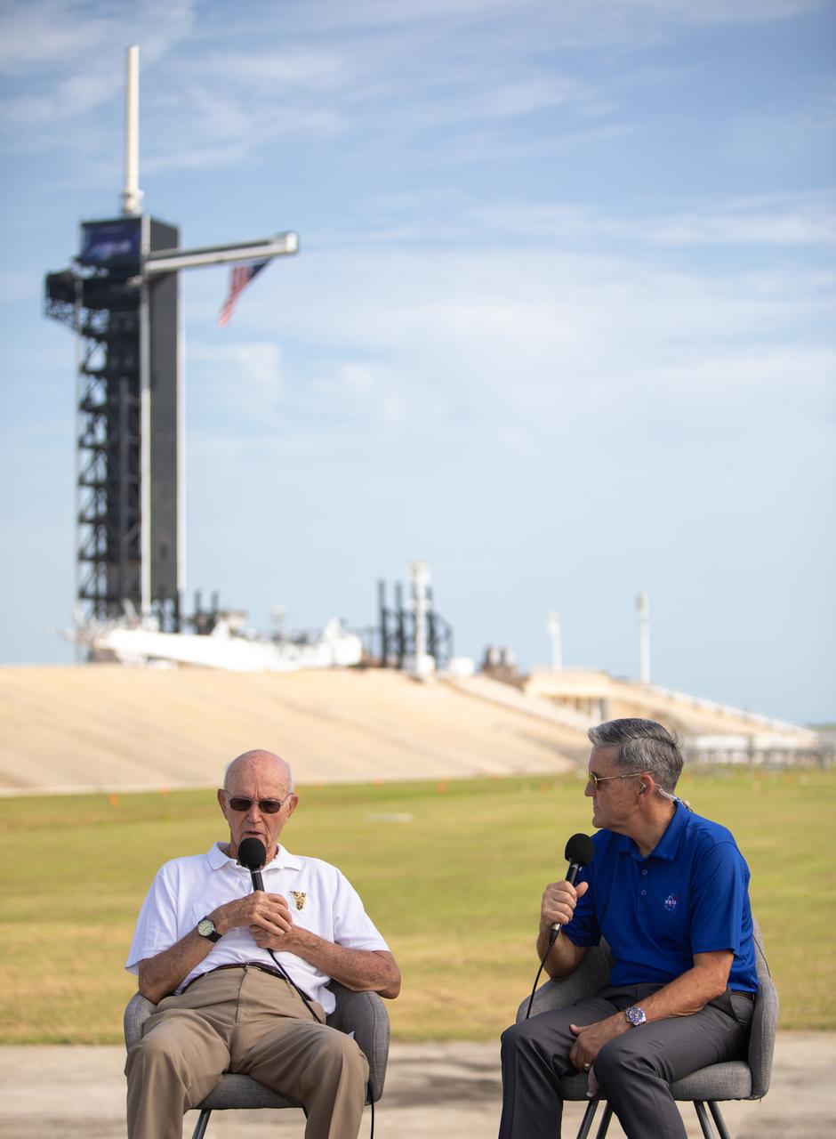 On July 16, 2019, the 50th anniversary of the Apollo 11 launch, astronaut Michael Collins, left, speaks to Kennedy Space Center Director Bob Cabana at Launch Complex 39A. During his visit to the Florida spaceport, Collins discussed the moments leading up to launch at 9:32 a.m. on July 16, 1969, and what it was like to be part of the first crew to land on the Moon. 