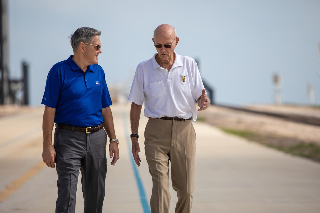 On July 16, 2019, the 50th anniversary of the Apollo 11 launch, astronaut Michael Collins, right, speaks to Kennedy Space Center Director Bob Cabana at Launch Complex 39A. During his visit to the Florida spaceport, Collins discussed the moments leading up to launch at 9:32 a.m. on July 16, 1969, and what it was like to be part of the first crew to land on the Moon. 