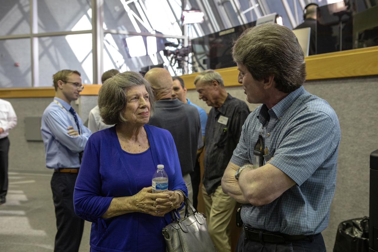 On July 16, 2019, the 50th anniversary of the Apollo 11 launch to the Moon, Apollo-era launch team member JoAnn Morgan, left, talks with an Artemis 1 launch team member in Launch Control Center Firing Room 1 at NASA's Kennedy Space Center in Florida. Morgan was the only female launch team member in the firing room during Apollo 11 launch countdown activities. 
