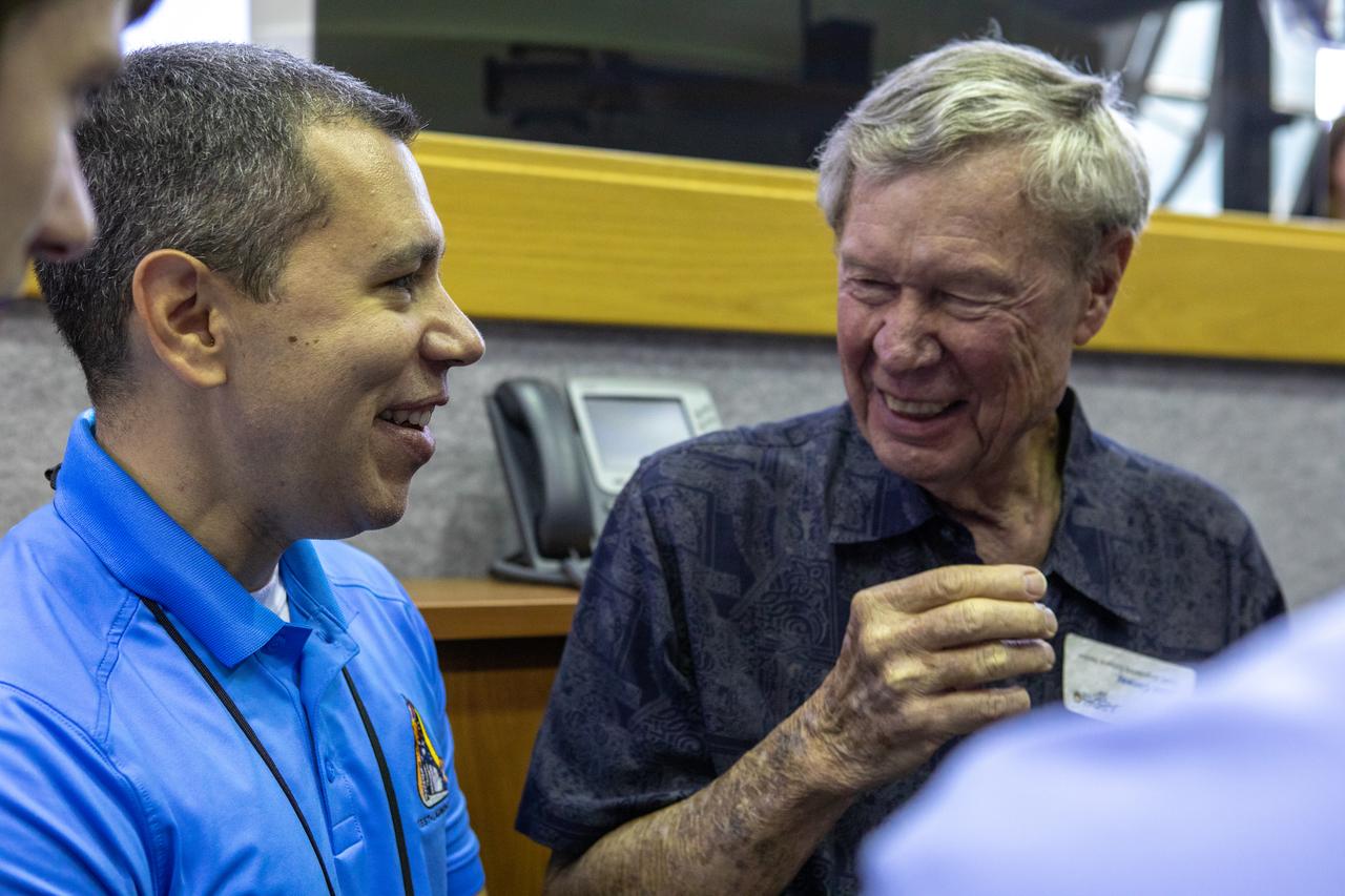 On July 16, 2019, the 50th anniversary of the Apollo 11 launch to the Moon, Apollo-era and Artemis 1 launch team members mingle in  Launch Control Center Firing Room 1 at NASA's Kennedy Space Center in Florida.