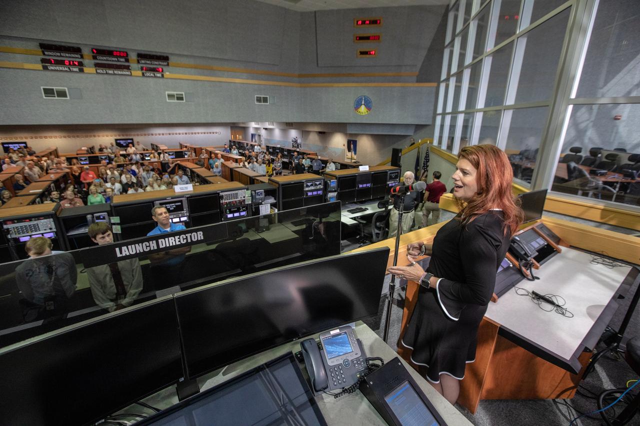 On July 16, 2019, the 50th anniversary of the Apollo 11 launch to the Moon, Artemis 1 Launch Director Charlie Blackwell-Thompson stands in Firing Room 1 in the Launch Control Center at NASA's Kennedy Space Center in Floirda. Apollo 11 and Artemis 1 launch team members mingle in the firing room.