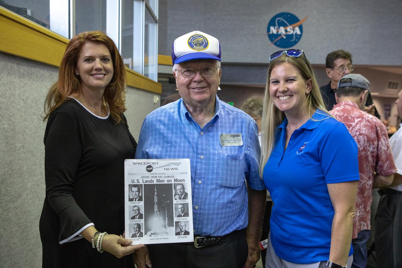 On July 16, 2019, the 50th anniversary of the Apollo 11 launch, Apollo-era and Artemis 1 workers gathered together in Launch Control Center Firing Room 1 at NASA's Kennedy Space Center in Florida. From left, are Artemis 1 Launch Director Charlie Blackwell-Thompson, Apollo-era launch team member Carl Green, and Tiffany Lindsley Wardlow, strategic communications specialist in Exploration Ground Systems.