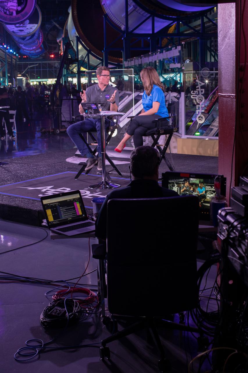Derrol Nail, left, and Marie Lewis, NASA Office of Communications, host a special Apollo 11 show titled “NASA’s Giant Leaps: Past and Future” on July 19, 2019. The show, which honored the heroes of Apollo and examined NASA’s future plans, was broadcast live from Kennedy Space Center’s Apollo/Saturn V Center in Florida. It featured segments from across the nation, including The National Mall in Washington, NASA’s Johnson Space Center in Houston, Neil Armstrong’s hometown of Wapakoneta, Ohio, and the Apollo 11 command module on display at the Museum of Flight in Seattle.