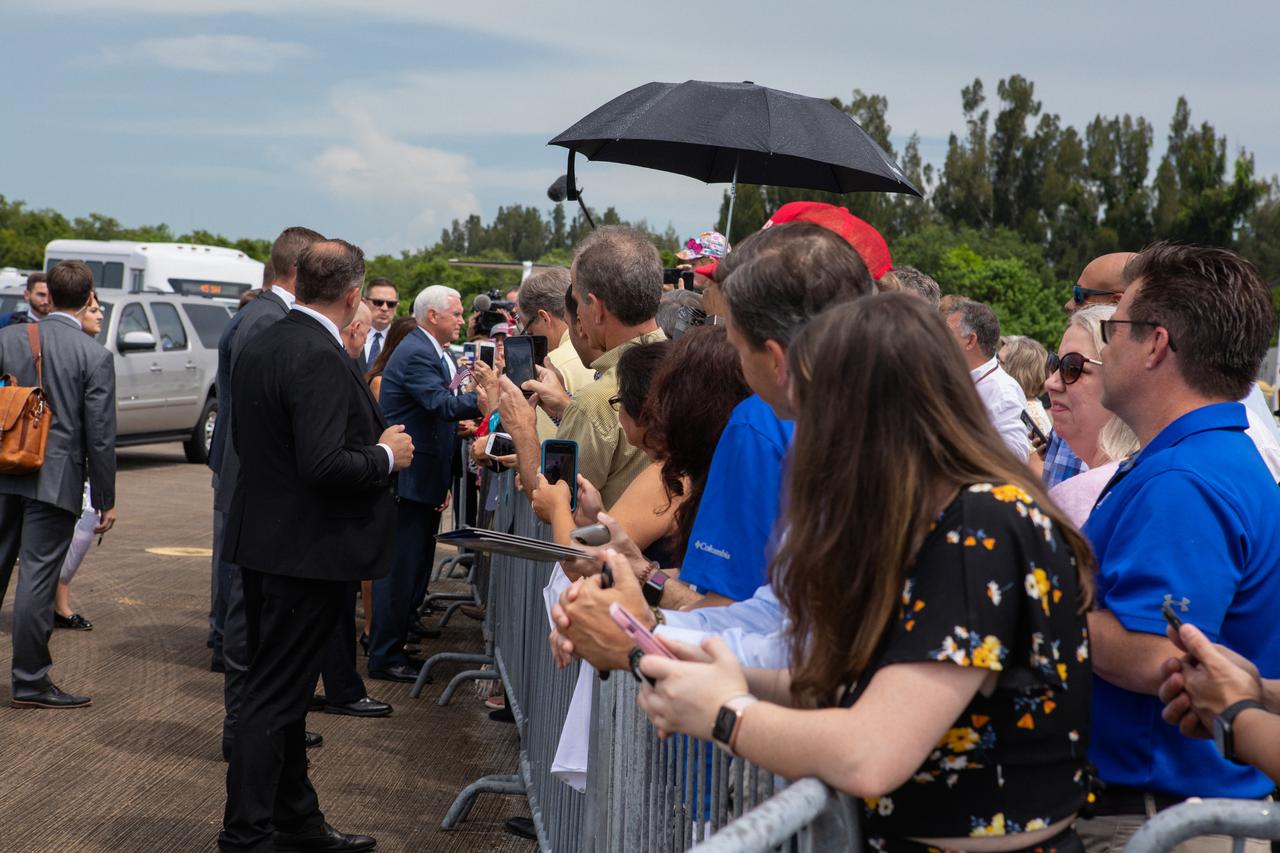 Vice President Pence arrives at Kennedy Space Center's Shuttle Landing Facility on July 20, 2019 and greets workers. Pence, who chairs the National Space Council, visited the Florida spaceport on the 50th anniversary of the Apollo 11 mission, which landed the first two humans on the Moon. He recognized the historic mission, while also addressing NASA’s future plans to travel to the Moon and on to Mars. 