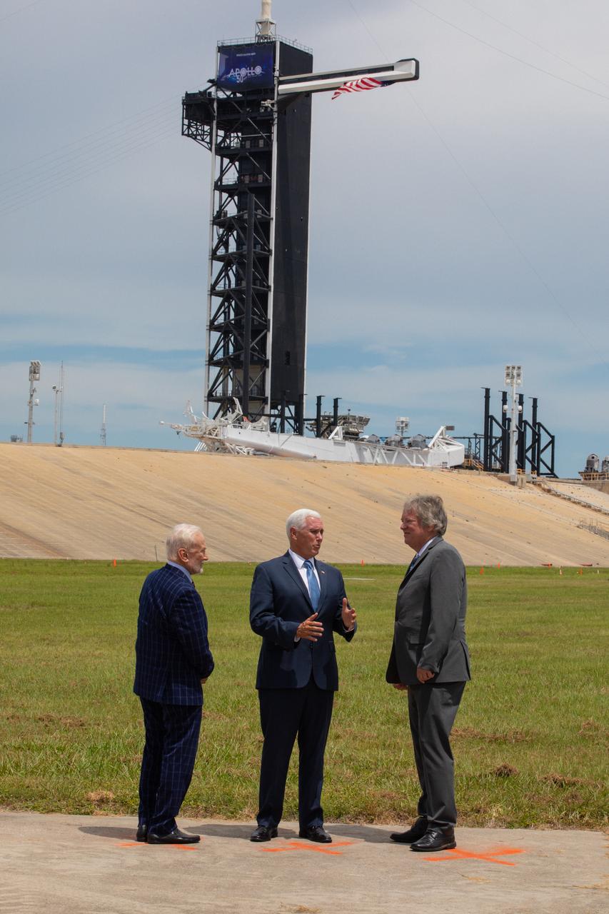 Vice President Mike Pence, center, celebrates the 50th anniversary of the Apollo 11 Moon landing during a visit to Kennedy Space Center’s Launch Complex 39A on July 20, 2019. Neil Armstrong, Buzz Aldrin and Michael Collins launched from Pad 39A aboard a Saturn V rocket on July 16, 1969. Four days later, Armstrong and Aldrin landed the Apollo Lunar Module Eagle on the Moon, becoming the first two humans to walk on the lunar surface. Pence recognized the extraordinary achievements of the Apollo 11 team, while looking forward to NASA’s plans to return to the Moon and on to Mars. At left is Apollo 11 Lunar Module Pilot Buzz Aldrin. At right is Rick Armstrong, Apollo 11 Commander Neil Armstrong's son.