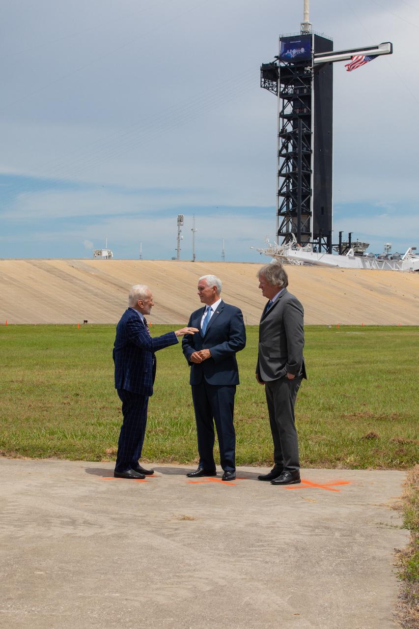 Vice President Mike Pence, center, celebrates the 50th anniversary of the Apollo 11 Moon landing during a visit to Kennedy Space Center’s Launch Complex 39A on July 20, 2019. Neil Armstrong, Buzz Aldrin and Michael Collins launched from Pad 39A aboard a Saturn V rocket on July 16, 1969. Four days later, Armstrong and Aldrin landed the Apollo Lunar Module Eagle on the Moon, becoming the first two humans to walk on the lunar surface. Pence recognized the extraordinary achievements of the Apollo 11 team, while looking forward to NASA’s plans to return to the Moon and on to Mars. At left is Apollo 11 Lunar Module Pilot Buzz Aldrin. At right is Rick Armstrong, Apollo 11 Commander Neil Armstrong's son.