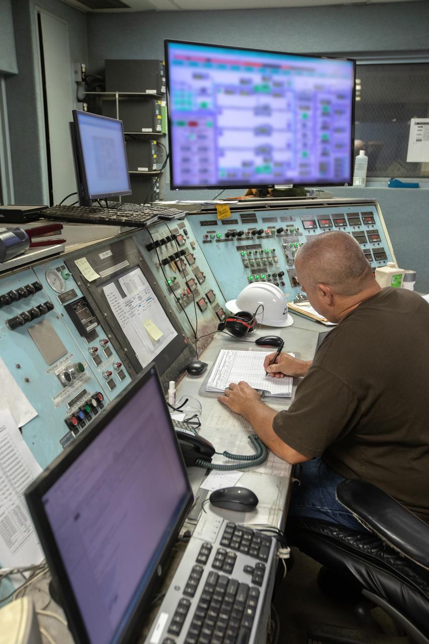 A technician monitors conditions in a control room inside the Utility Annex near the Vehicle Assembly (VAB) Building at NASA’s Kennedy Space Center in Florida on July 24, 2019. The Utility Annex, which provides 8,000 gallons of chilled water per minute to the VAB and other facilities in the Launch Complex 39 area, is being upgraded and repaired. The facility also contains boilers necessary to provide hot water to the VAB. The center’s Engineering Directorate is making the repairs and upgrades to the facility to prepare for the agency’s Artemis missions to the Moon and on to Mars.