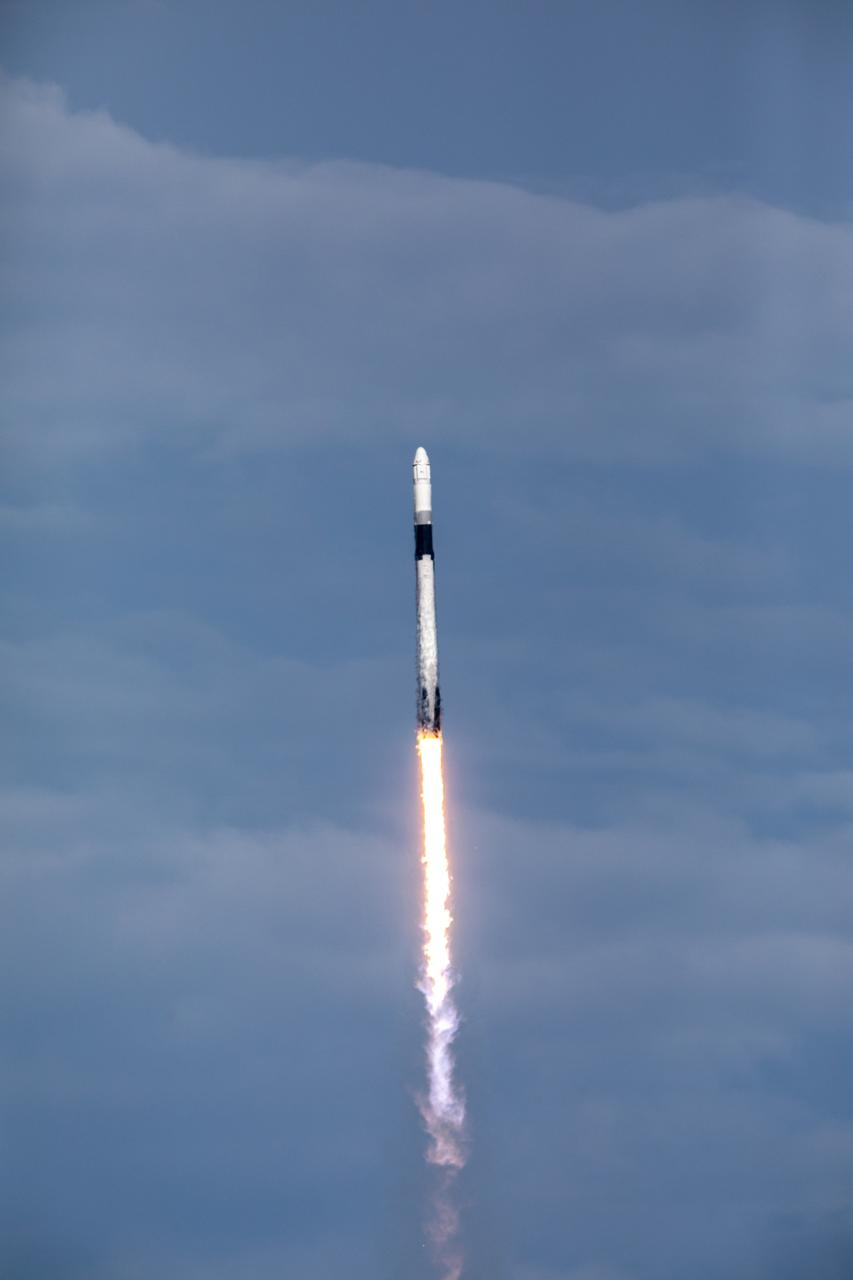 A SpaceX Falcon 9 rocket soars upward after its liftoff from Space Launch Complex 40 at Cape Canaveral Air Force Station in Florida at 6:01 p.m. EDT on July 25, 2019, carrying the Dragon spacecraft on the company’s 18th Commercial Resupply Services (CRS-18) mission to the International Space Station.  The uncrewed Dragon spacecraft will deliver about 5,000 pounds of science and research, crew supplies and vehicle hardware to the orbiting laboratory. 