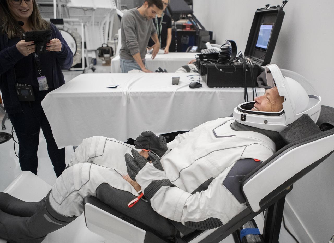 NASA and SpaceX held a joint training event for pre-launch operations, which provided an opportunity for the crew and ground operators to rehearse all of the activities, procedures, and communication the teams will exercise on launch day from crew suit-up in Kennedy Space Center’s Operations & Checkout (O&C) building in Florida through launch; this training event also included simulated emergency egress scenarios. NASA astronaut Doug Hurley is participating in a suit-up for launch, using the same Ground Support Equipment hardware, such as the seats and suit leak check boxes, that the crew will use for launch, with the SpaceX ground closeout team and suit engineers that will help the crew suit up and ingress the Dragon on launch day. Following crew suit-up, the crew ingressed the capsule simulator in Hawthorne, California, as they would on launch day, and the teams performed a simulated launch countdown and several emergency egress scenarios.