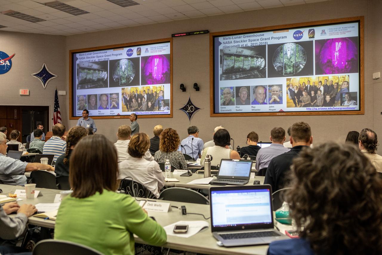 The Exploration Research and Technology Programs at NASA’s Kennedy Space Center in Florida hosted a two-day workshop, Aug. 6 and 7, 2019, focusing on robotics and automation in space crop production. Participants from around the world and members of NASA, industry, academia and other government agencies met to share their knowledge to enable a common goal of sustaining human operations on the Moon, in deep space and eventually on Mars. Keynote speakers and representatives from different organizations presented data gleaned from their research. Murat Kacira, left, a professor in the Department of Agricultural and Biosystems Engineering and director of the Controlled Environment Agriculture Program at the University of Arizona, and Barry Pryor, a professor with the School of Plant Sciences, also at the University of Arizona, present to workshop attendees on Aug. 6.