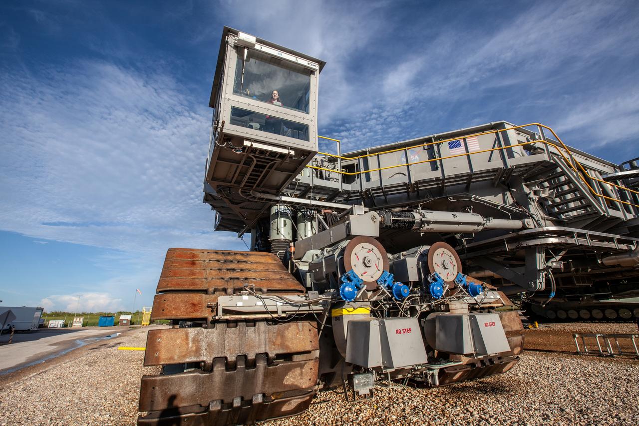 Breanne Stichler, mechanical engineer I, is photographed inside the cab of NASA’s Crawler-Transporter 2 (CT-2) at the Kennedy Space Center in Florida on Aug. 8, 2019. Stichler started working at Kennedy in June and is among one of the few females to have ever driven the crawler. CT-2 will carry the agency’s mobile launcher with the Space Launch System rocket from the Vehicle Assembly Building to Launch Pad 39B for the launch of Artemis 1, the first in a series of complex missions that will provide the foundation for human deep space exploration. 