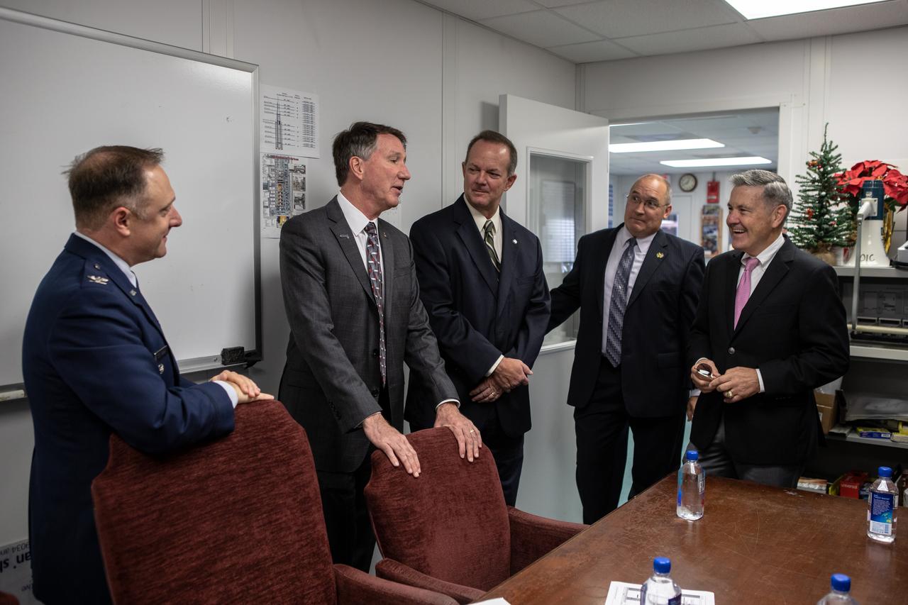 Just before a ribbon cutting ceremony on Aug. 16, 2019, in High Bay 2 of the Vehicle Assembly (VAB) at NASA’s Kennedy Space Center in Florida, Center Director Bob Cabana, at right, visits with, from left, Col. Thomas Ste. Marie, vice commander, U.S. Air Force, 45th Space Wing; Kurt Rominger, Northrop Grumman’s vice president and capture lead for the OmegA launch system; Tom Engler, director of Kennedy’s Center Planning and Development Office; and Greg Harland, NASA communications. The VAB is getting its first commercial tenant. Northrop Grumman signed a Reimbursable Space Act Agreement with NASA for use of the facilities. The company will assemble and test its new OmegA rocket inside the massive facility’s High Bay 2. The company also will modify the space shuttle-era mobile launcher platform-3 to serve as the launch vehicle’s assembly and launch platform. Northrop Grumman is developing the OmegA rocket, an intermediate/heavy-class launch vehicle, as part of a launch services agreement with the U.S. Air Force.