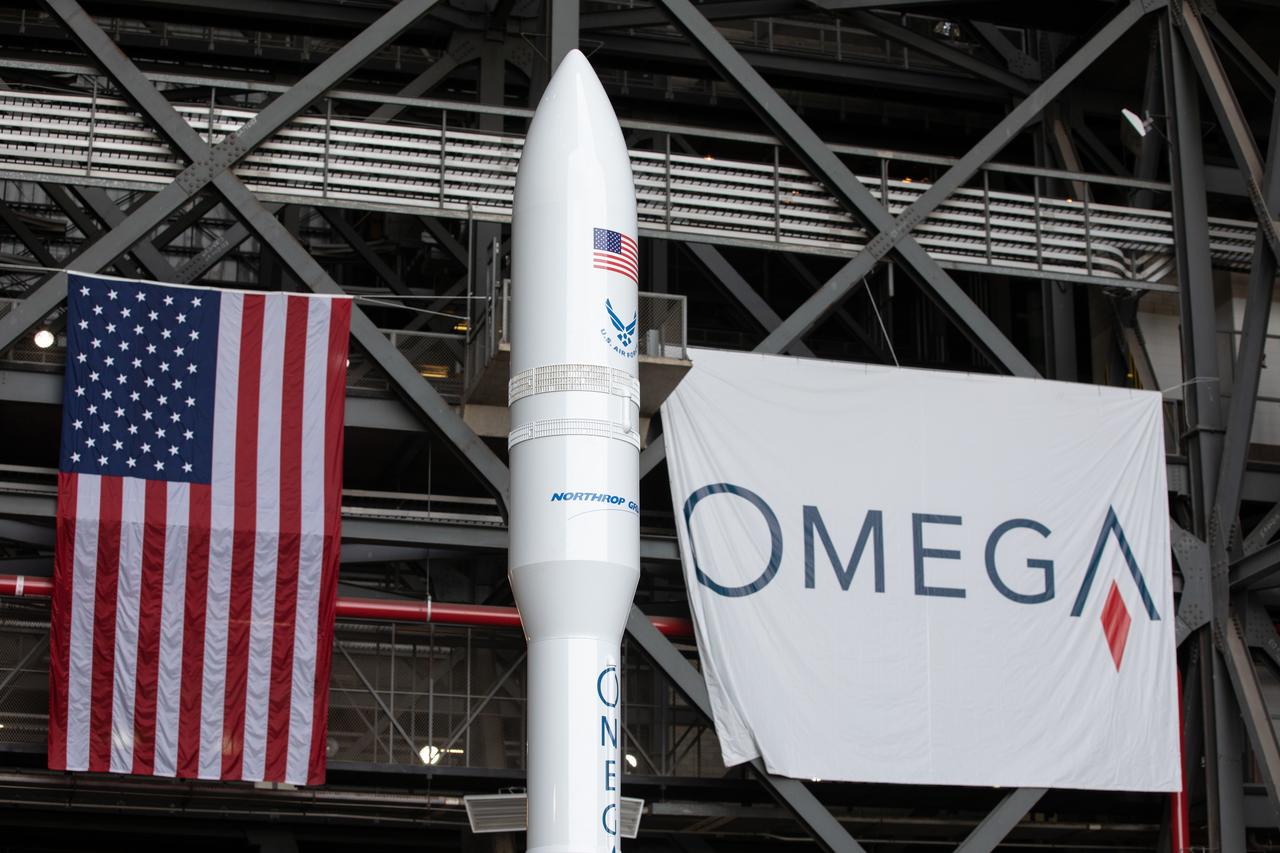 During a ribbon cutting ceremony on Aug. 16, 2019, in High Bay 2 of the Vehicle Assembly Building (VAB) at NASA’s Kennedy Space Center in Florida, a scale model of the Northrop Grumman OmegA launch system is in view. The VAB is getting its first commercial tenant. Northrop Grumman signed a Reimbursable Space Act Agreement with NASA for use of the facilities. The company will assemble and test its new OmegA rocket inside the massive facility’s High Bay 2. The company also will modify mobile launcher platform-3 to serve as the launch vehicle’s assembly and launch platform. Northrop Grumman is developing the OmegA rocket, an intermediate/heavy-class launch vehicle, as part of a launch services agreement with the U.S. Air Force.