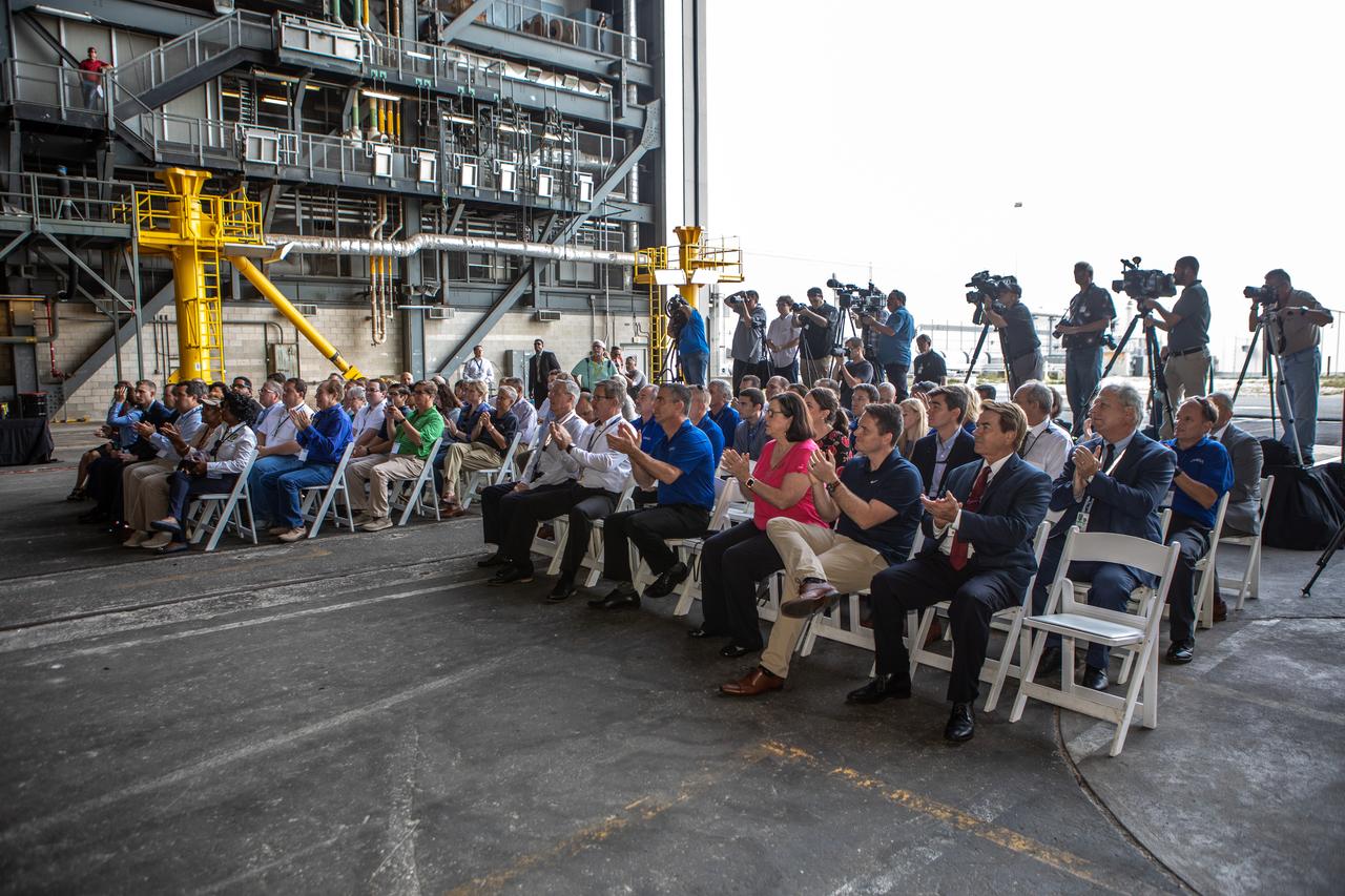 Legislators and invited guests clap during a ribbon cutting ceremony on Aug. 16, 2019, in High Bay 2 of the Vehicle Assembly Building (VAB) at NASA’s Kennedy Space Center in Florida. The VAB is getting its first commercial tenant. Northrop Grumman signed a Reimbursable Space Act Agreement with NASA for use of the facilities. The company will assemble and test its new OmegA rocket inside the massive facility’s High Bay 2. The company also will modify mobile launcher platform-3 to serve as the launch vehicle’s assembly and launch platform. Northrop Grumman is developing the OmegA rocket, an intermediate/heavy-class launch vehicle, as part of a launch services agreement with the U.S. Air Force.