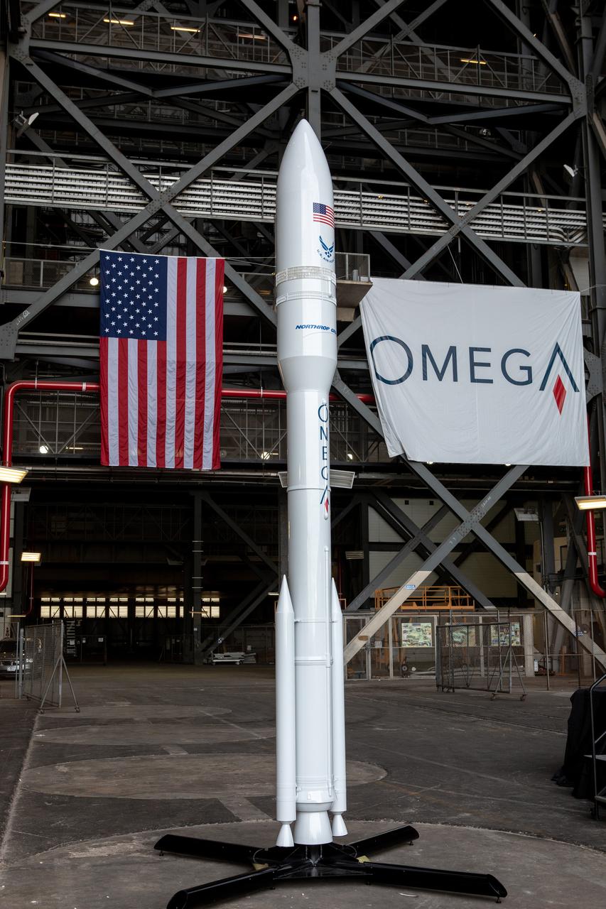 During a ribbon cutting ceremony on Aug. 16, 2019, in High Bay 2 of the Vehicle Assembly Building (VAB) at NASA’s Kennedy Space Center in Florida, a scale model of the Northrop Grumman OmegA launch system is on display. The VAB is getting its first commercial tenant. Northrop Grumman signed a Reimbursable Space Act Agreement with NASA for use of the facilities. The company will assemble and test its new OmegA rocket inside the massive facility’s High Bay 2. The company also will modify mobile launcher platform-3 to serve as the launch vehicle’s assembly and launch platform. Northrop Grumman is developing the OmegA rocket, an intermediate/heavy-class launch vehicle, as part of a launch services agreement with the U.S. Air Force.