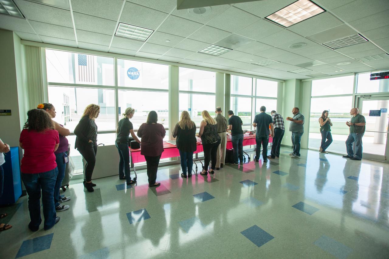 Kennedy Space Center employees sample food at the “KSC and Proud to Be” centerwide diversity event held at the Florida spaceport’s Operations Support Building II (OSB II) on Aug. 20, 2019. The event featured a presentation by Robin Hauser, a director and producer of award-winning documentaries. Hauser, who has spoken at the White House and at conferences worldwide, addressed bias in artificial intelligence. A new employee video focusing on the importance of employee resource groups at the center made its debut showing at the event.