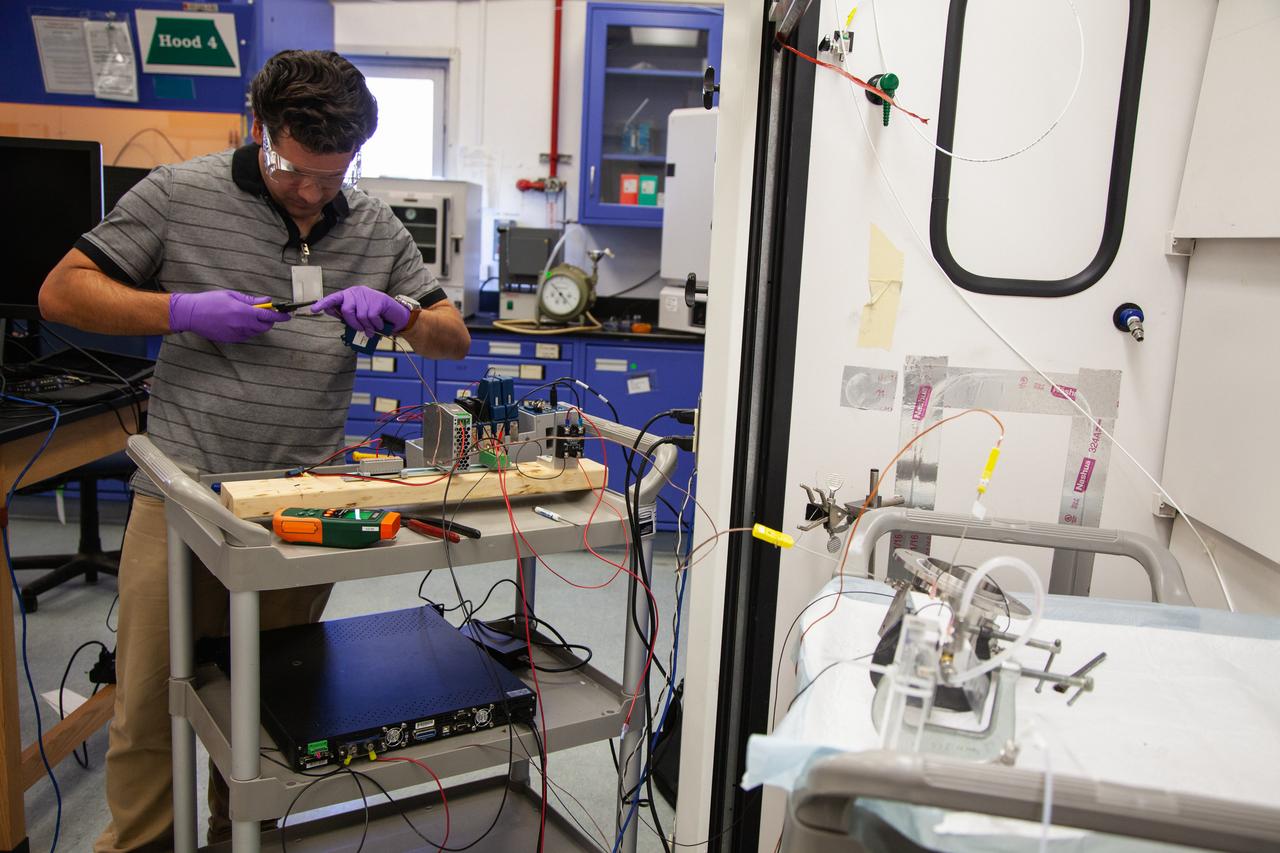 A Kennedy Space Center employee works on assembling the flight hardware of NASA’s Orbital Syngas Commodity Augmentation Reactor, or OSCAR – an Early Career Initiative project at the Florida spaceport that studies technology to convert trash and human waste into useful gasses such as methane, hydrogen and carbon dioxide. By processing small pieces of trash in a high-temperature reactor, OSCAR is advancing new and innovative technology for managing waste in space. OSCAR would reduce the amount of space needed for waste storage within a spacecraft, turn some waste into gasses that have energy storage and life support applications and ensure waste is no longer biologically active. A prototype has already been developed, and a team of Kennedy employees are in the process of constructing a new rig for suborbital flight testing. 