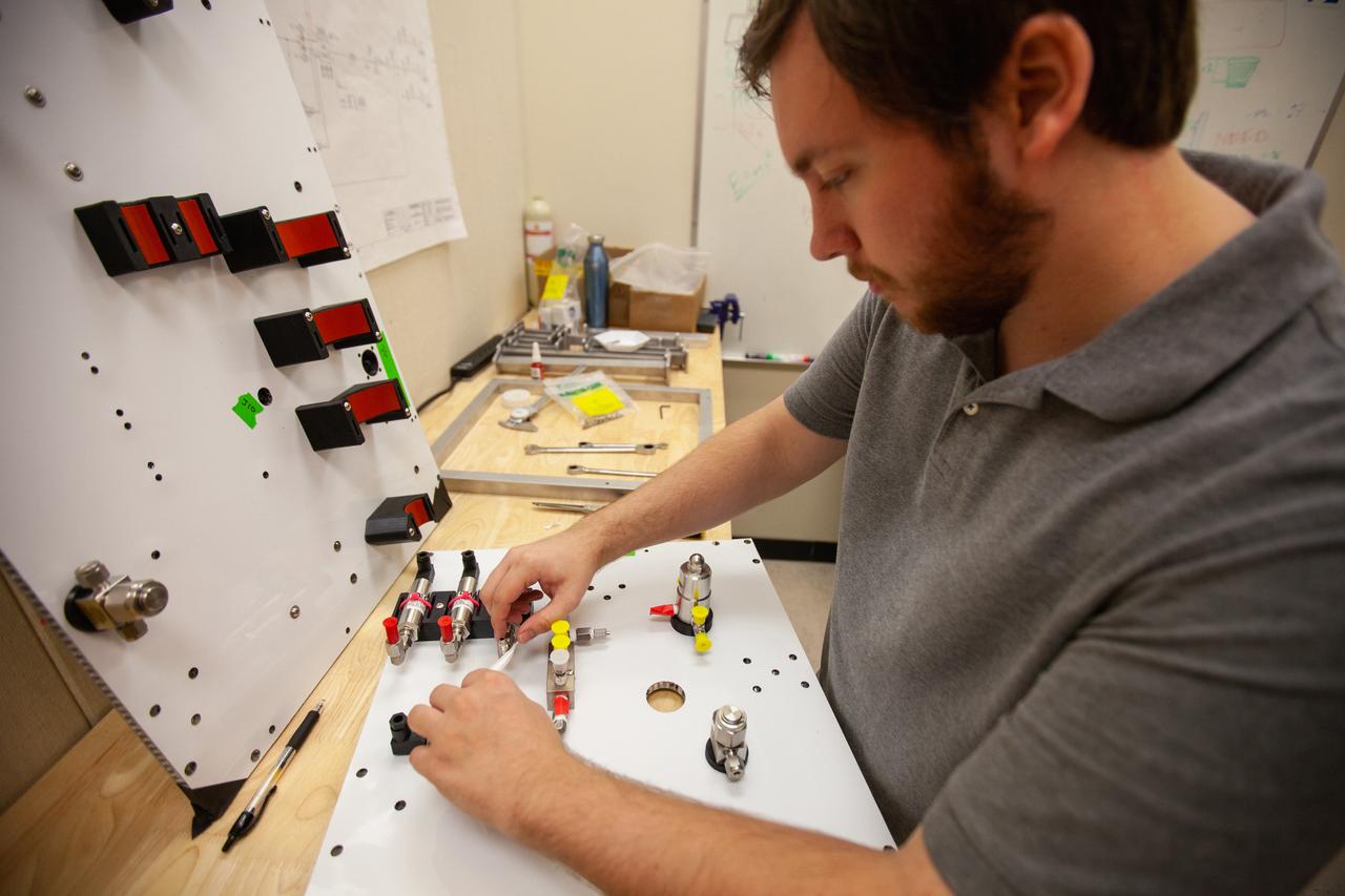 A Kennedy Space Center employee works on assembling the flight hardware of NASA’s Orbital Syngas Commodity Augmentation Reactor, or OSCAR – an Early Career Initiative project at the Florida spaceport that studies technology to convert trash and human waste into useful gasses such as methane, hydrogen and carbon dioxide. By processing small pieces of trash in a high-temperature reactor, OSCAR is advancing new and innovative technology for managing waste in space. OSCAR would reduce the amount of space needed for waste storage within a spacecraft, turn some waste into gasses that have energy storage and life support applications and ensure waste is no longer biologically active. A prototype has already been developed, and a team of Kennedy employees are in the process of constructing a new rig for suborbital flight testing. 