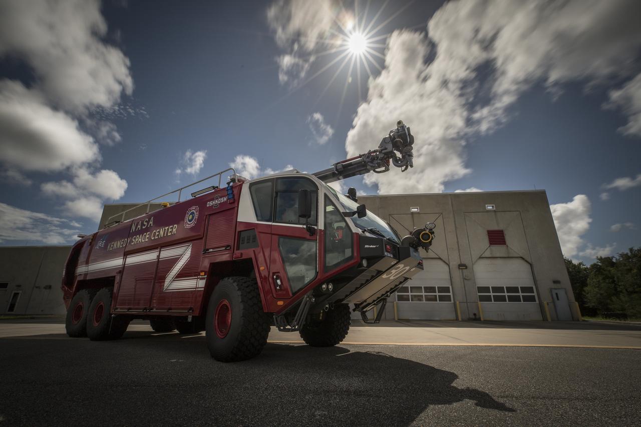 A new Aircraft Rescue and Fire Fighting vehicle is photographed in front of Fire Station No. 2 near the Shuttle Landing Facility runway at NASA’s Kennedy Space Center in Florida. The state-of-the-art truck replaces a 28-year-old vehicle. Kennedy is upgrading its fleet of emergency vehicles to enhance its safety and security posture at the growing, multi-user spaceport.