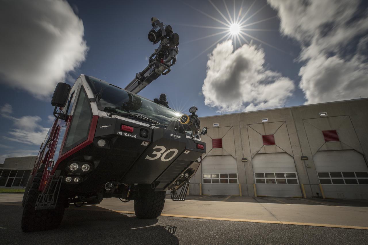A new Aircraft Rescue and Fire Fighting vehicle is photographed in front of Fire Station No. 2 near the Shuttle Landing Facility runway at NASA’s Kennedy Space Center in Florida. The state-of-the-art truck replaces a 28-year-old vehicle. Kennedy is upgrading its fleet of emergency vehicles to enhance its safety and security posture at the growing, multi-user spaceport.