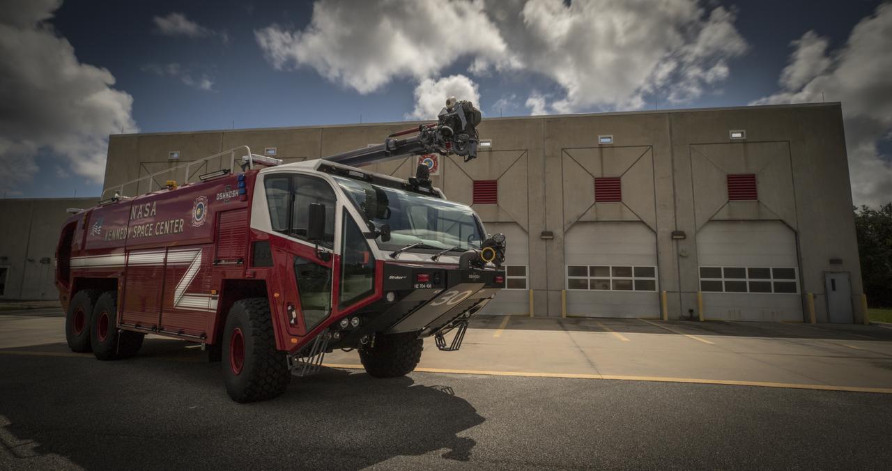 A new Aircraft Rescue and Fire Fighting vehicle is photographed in front of Fire Station No. 2 near the Shuttle Landing Facility runway at NASA’s Kennedy Space Center in Florida. The state-of-the-art truck replaces a 28-year-old vehicle. Kennedy is upgrading its fleet of emergency vehicles to enhance its safety and security posture at the growing, multi-user spaceport.