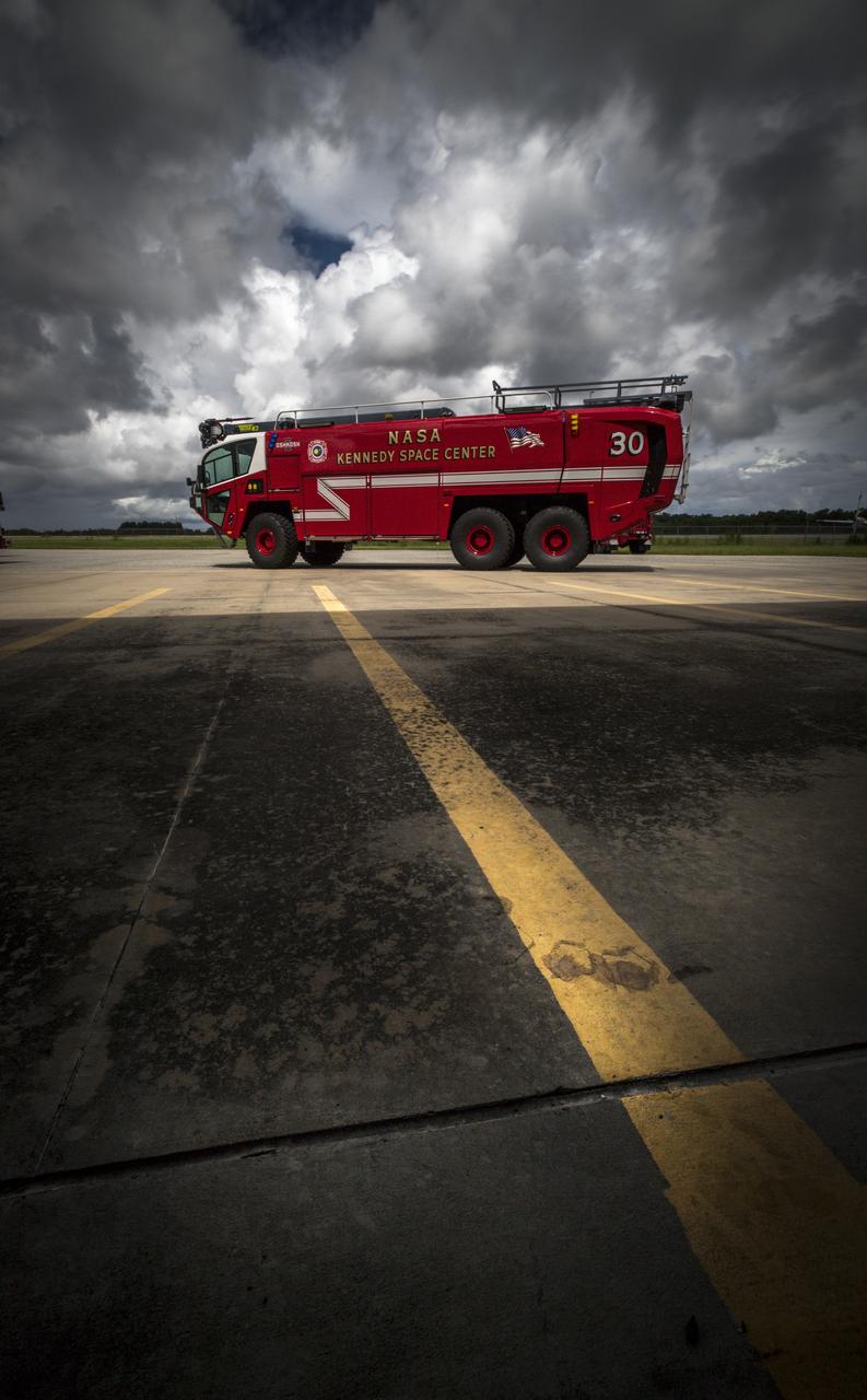 A new Aircraft Rescue and Fire Fighting vehicle is backdropped by the Shuttle Landing Facility runway at NASA’s Kennedy Space Center in Florida. The state-of-the-art truck replaces a 28-year-old vehicle. Kennedy is upgrading its fleet of emergency vehicles to enhance its safety and security posture at the growing, multi-user spaceport.