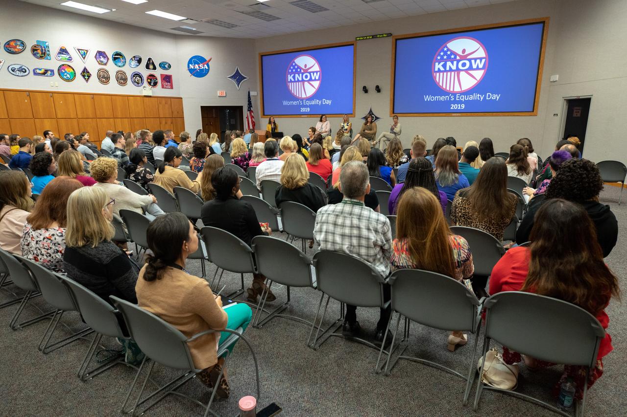 A panel discussion, featuring women in leadership roles at NASA’s Kennedy Space Center in Florida, is held on Aug. 26, 2019, to celebrate Women’s Equality Day. The event, sponsored by the Kennedy Networking Opportunities for Women (KNOW) employee resource group, honored the 100th anniversary of the passing of the 19th amendment guaranteeing all American women the right to vote. Seated in front from left, are Digna Carballosa, director of the Human Resources Office; Nancy Bray, director of Spaceport Integration and Services; Jennifer Kunz, director of Safety and Mission Assurance; and Amanda Mitskevich, Launch Services Program manager. At far left is Ashley Nelsen, Launch Service Program information manager and panel discussion moderator. The purpose of KNOW is to provide focus on issues such as employment, retention, promotion, training, career and personal development, education, and identify and eliminate barriers that hinder the advancement of women in the workforce.