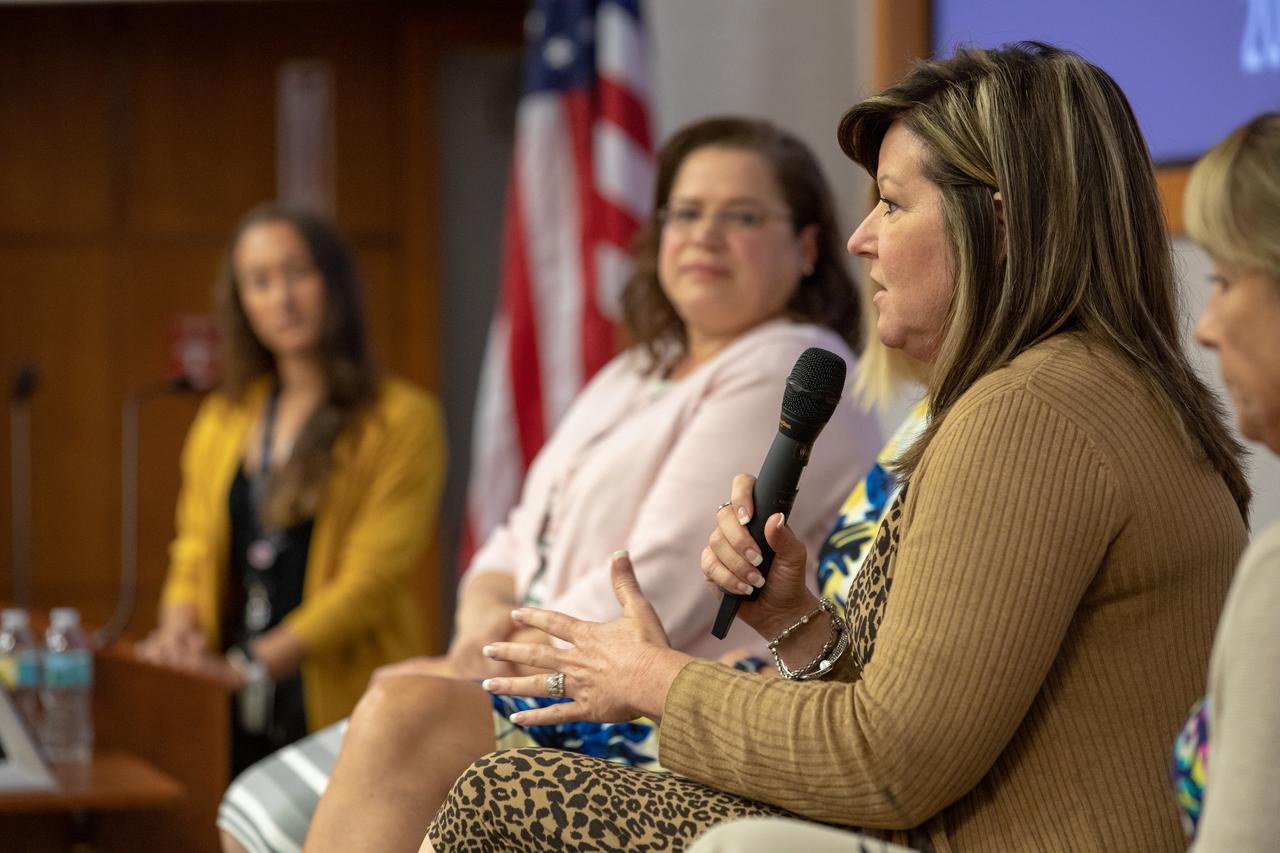 A panel discussion, featuring women in leadership roles at NASA’s Kennedy Space Center in Florida, is held on Aug. 26, 2019, to celebrate Women’s Equality Day. The event, sponsored by the Kennedy Networking Opportunities for Women (KNOW) employee resource group, honored the 100th anniversary of the passing of the 19th amendment guaranteeing all American women the right to vote. Jennifer Kunz, director of Safety and Mission Assurance, answers a question. Seated at left is Digna Carballosa, director of the Human Resources Office. At far left is Ashley Nelsen, Launch Service Program information manager and panel discussion moderator. The purpose of KNOW is to provide focus on issues such as employment, retention, promotion, training, career and personal development, education, and identify and eliminate barriers that hinder the advancement of women in the workforce.