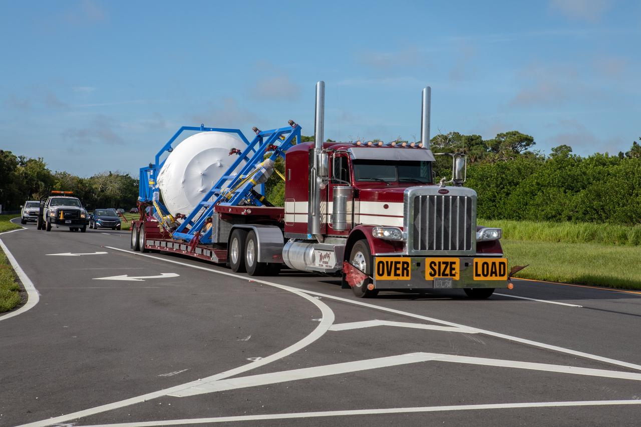 The cargo logistics module for Sierra Nevada Corporation’s Dream Chaser, the company’s reusable spaceplane, is in transit to the Space Station Processing Facility at NASA’s Kennedy Space Center in Florida on Aug. 27, 2019. The cargo module – a 15-foot attachment to Dream Chaser – provides extra storage for payloads and provides cargo disposal upon re-entry into Earth’s atmosphere. Dream Chaser will deliver more than 12,000 pounds of cargo to the International Space Station under NASA’s Commercial Resupply Services 2 contract. The spacecraft and cargo module will begin resupply and return services missions to the space station in late 2021.