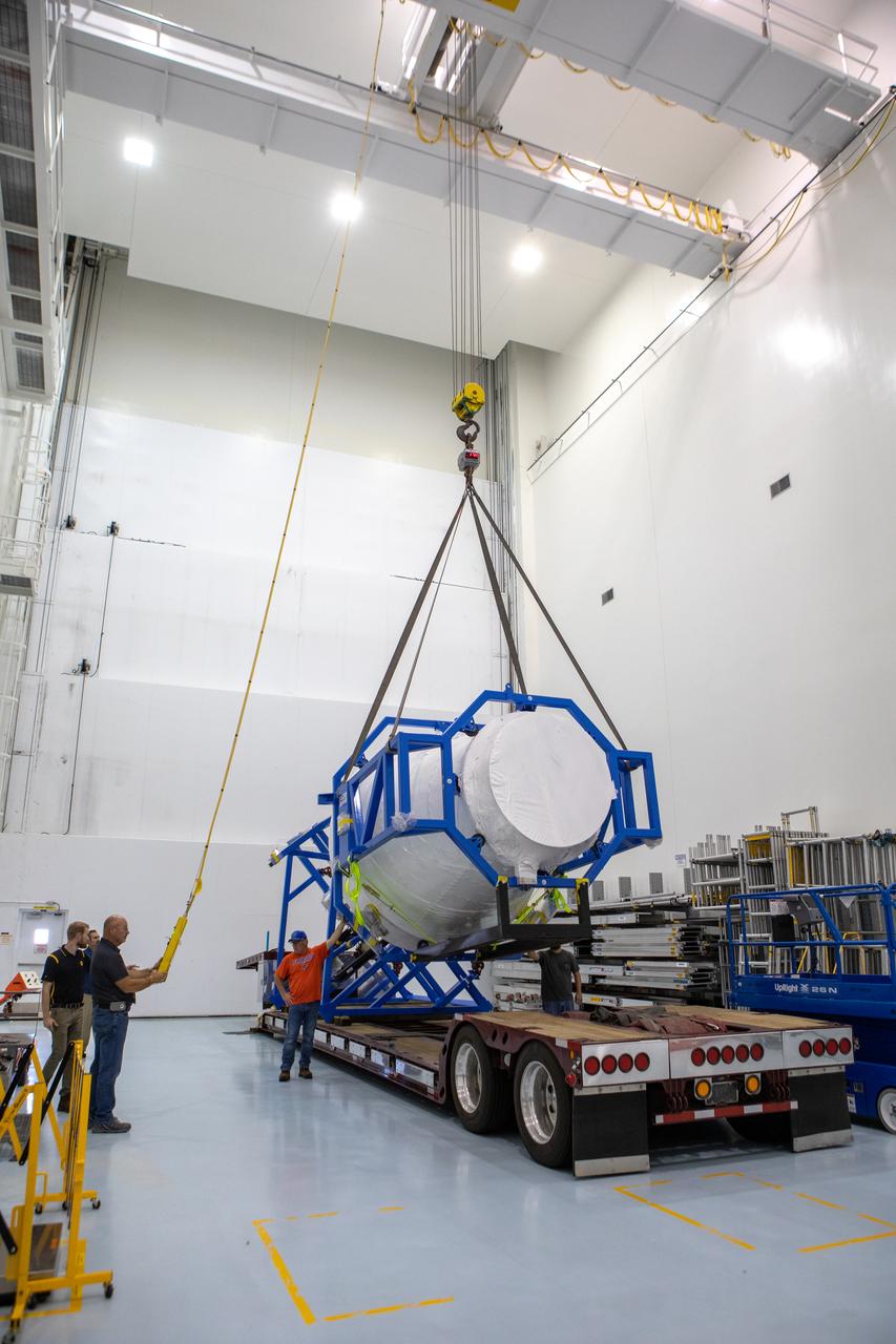 The cargo logistics module for Sierra Nevada Corporation’s Dream Chaser, the company’s reusable spaceplane, is lifted from the bed of a truck following its arrival at the Space Station Processing Facility high bay at NASA’s Kennedy Space Center in Florida on Aug. 27, 2019. The cargo module – a 15-foot attachment to Dream Chaser – provides extra storage for payloads and provides cargo disposal upon re-entry into Earth’s atmosphere. Dream Chaser will deliver more than 12,000 pounds of cargo to the International Space Station under the agency’s Commercial Resupply Services 2 contract. The spacecraft and cargo module will begin resupply and return services missions to the space station in late 2021. 