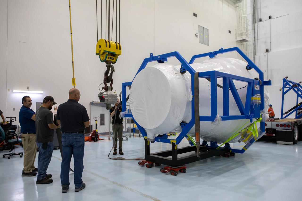 The cargo logistics module for Sierra Nevada Corporation’s Dream Chaser, the company’s reusable spaceplane, is photographed inside the Space Station Processing Facility high bay at NASA’s Kennedy Space Center in Florida following its arrival on Aug. 27, 2019. The cargo module – a 15-foot attachment to Dream Chaser – provides extra storage for payloads and provides cargo disposal upon re-entry into Earth’s atmosphere. Dream Chaser will deliver more than 12,000 pounds of cargo to the International Space Station under the agency’s Commercial Resupply Services 2 contract. The spacecraft and cargo module will begin resupply and return services missions to the space station in late 2021. 