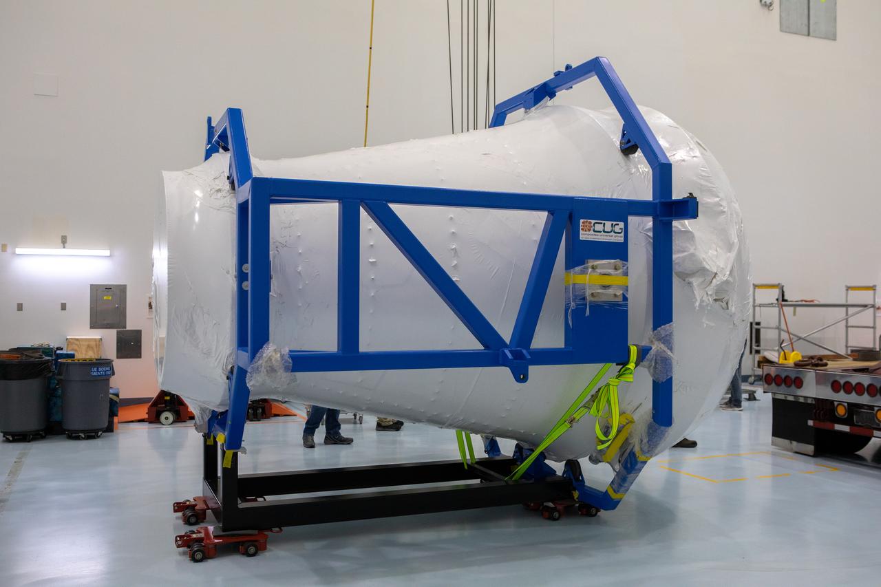 The cargo logistics module for Sierra Nevada Corporation’s Dream Chaser, the company’s reusable spaceplane, is photographed inside the Space Station Processing Facility high bay at NASA’s Kennedy Space Center in Florida following its arrival on Aug. 27, 2019. The cargo module – a 15-foot attachment to Dream Chaser – provides extra storage for payloads and provides cargo disposal upon re-entry into Earth’s atmosphere. Dream Chaser will deliver more than 12,000 pounds of cargo to the International Space Station under the agency’s Commercial Resupply Services 2 contract. The spacecraft and cargo module will begin resupply and return services missions to the space station in late 2021. 