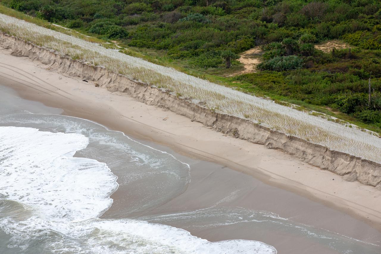An aerial survey of NASA's Kennedy Space Center in Florida was conducted after Hurricane Dorian skirted the Space Coast area. The survey was performed to identify structures and facilities that may have sustained damage from Hurricane Dorian as the storm passed to the east of Kennedy on September 3 and 4, 2019. Officials determined that the center received some isolated damage and limited water intrusion. Beach erosion also occurred, although the storm surge was less than expected. NASA closed the center ahead of the storm’s onset and only a small team of specialists known as the Rideout Team was on the center as the storm approached and passed.