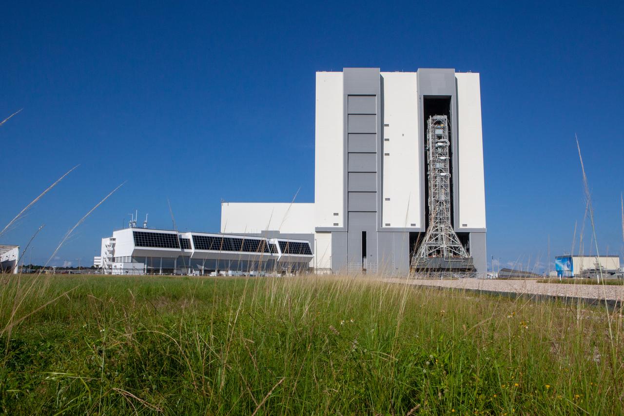 The mobile launcher for NASA’s Artemis missions rolls out of the Vehicle Assembly Building (VAB) at Kennedy Space Center in Florida on Sept. 10, 2019, after spending a week and a half inside due to the approach of Hurricane Dorian. The nearly 400-foot-tall structure was moved from Launch Pad 39B to the VAB for safekeeping on Aug. 30. The storm passed about 70 miles east of the spaceport during the overnight hours Tuesday, Sept. 3, and Wednesday, Sept. 4. NASA’s Exploration Ground Systems is moving the mobile launcher back to the launch pad, where teams will complete testing and checkout on the launcher in the coming weeks for the Artemis I mission.