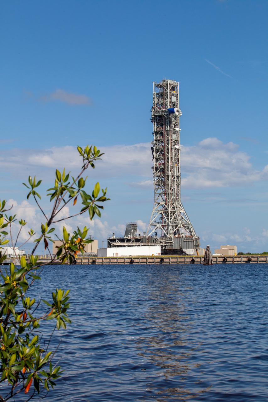 The mobile launcher for NASA’s Artemis missions rolls toward Launch Pad 39B at Kennedy Space Center in Florida on Sept. 10, 2019, after spending a week and a half inside due to the approach of Hurricane Dorian. The nearly 400-foot-tall structure was moved from Launch Pad 39B to the Vehicle Assembly Building for safekeeping on Aug. 30. The storm passed about 70 miles east of the spaceport during the overnight hours Tuesday, Sept. 3, and Wednesday, Sept. 4. NASA’s Exploration Ground Systems is moving the mobile launcher back to the launch pad, where teams will complete testing and checkout on the launcher in the coming weeks for the Artemis I mission.