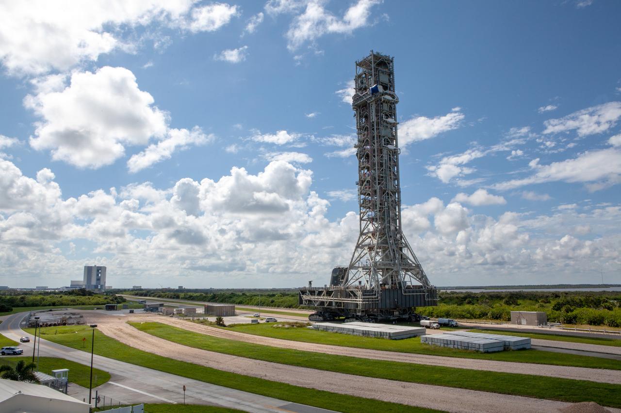NASA’s mobile launcher (ML) atop crawler-transporter 2 moves along the crawlerway on Sept. 10, 2019, after spending a week and a half inside the Vehicle Assembly Building (VAB) at Kennedy Space Center in Florida due to the approach of Hurricane Dorian. The nearly 400-foot-tall structure was moved from Launch Pad 39B to the VAB for safekeeping on Aug. 30. The storm passed about 70 miles east of the spaceport during the overnight hours Tuesday, Sept. 3, and Wednesday, Sept. 4. NASA’s Exploration Ground Systems is moving the mobile launcher back to the launch pad, where teams will complete testing and checkout on the launcher in the coming weeks for the Artemis I mission.