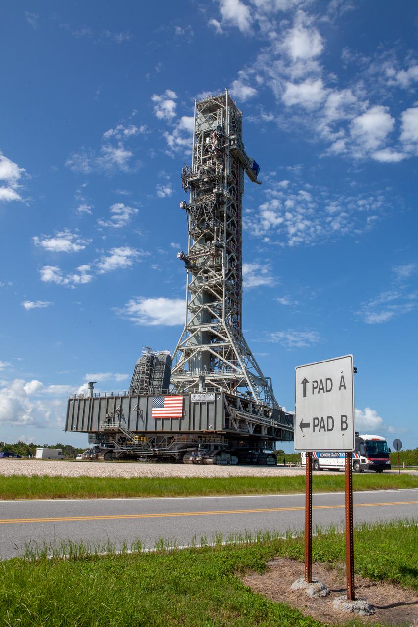 NASA’s mobile launcher (ML) atop crawler-transporter 2 moves along the crawlerway on Sept. 10, 2019, after spending a week and a half inside the Vehicle Assembly Building (VAB) at Kennedy Space Center in Florida due to the approach of Hurricane Dorian. The nearly 400-foot-tall structure was moved from Launch Pad 39B to the VAB for safekeeping on Aug. 30. The storm passed about 70 miles east of the spaceport during the overnight hours Tuesday, Sept. 3, and Wednesday, Sept. 4. NASA’s Exploration Ground Systems is moving the mobile launcher back to the launch pad, where teams will complete testing and checkout on the launcher in the coming weeks for the Artemis I mission.